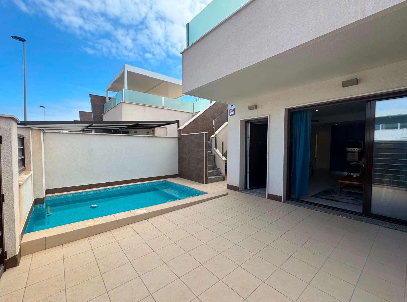 This modern property is located in the heart of San Pedro del Pinatar, offering style and convenience. Built in 2018, finished with premium materials and a contemporary design, this home offers a comfortable lifestyle in a sought-after location. The property is ideally located within walking distance of all local amenities in the charming coastal area of San Pedro del Pinatar. Whether looking for a family home or a holiday home, this modern home delivers on all levels.The property has an excellent layout with 3 large bedrooms with fitted wardrobes and 2 bathrooms designed for comfort and functionality. The living room and both bathrooms have underfloor heating, and the property is equipped with air conditioning to ensure a comfortable indoor temperature all year round. The kitchen is fully equipped with modern appliances, and the entire property is lit with energy-efficient LED spotlights. The living room has large sliding windows with solar control glass that allow great natural light while maintaining indoor comfort.The property is sold with all indoor and outdoor furniture - you really can move straight in!The outdoor area offers everything you need to enjoy the Mediterranean climate. On the ground level, there is a private pool and terrace. The 88m² roof terrace has a pergola, barbecuearea and outdoor kitchen, the perfect place to entertain guests and enjoy meals al fresco. There is also a storage room on the roof terrace. Picturesque San Pedro del Pinatar is located on the sunny Costa Cálida in south-eastern Spain. Known for its stunning beaches along the Mar Menor and the Mediterranean, this vibrant seaside town offers the perfect blend of natural beauty, leisure activities and modern facilities.Renowned for its therapeutic mud baths and the protected Las Salinas nature reserve, San Pedro is a favourite destination for wellness and outdoor enthusiasts. The area has a lively marina, excellent seafood restaurants and year-round sunshine. Whether strolling through the charming streets or enjoying water sports on the tranquil Mar Menor, San Pedro del Pinatar is a real gem in the Murcia region.This is a great and practical home ideal for enjoying your vacation, there's also rental potential.Don't miss this opportunity - schedule a viewing today!