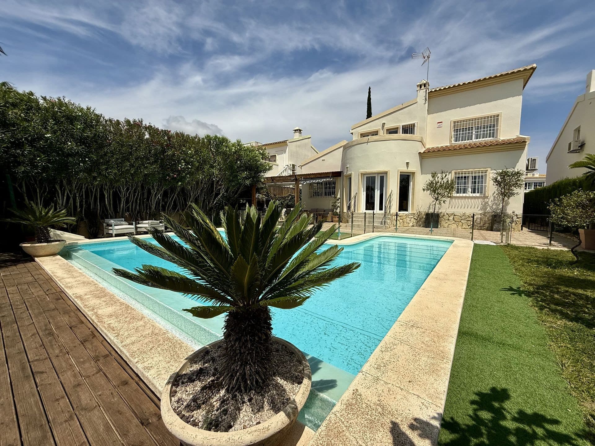 Beautiful Golf Villa surrounded by serene nature!. Visit this beautiful villa surrounded by serene nature. This fully renovated family home offers the perfect balance of modern comfort and ultimate privacy, ensuring you can enjoy your space peacefully. With two floors of thoughtfully designed living space, this property is the perfect sanctuary for those seeking peace and luxury.As you enter the villa, you’re greeted by a cosy living and dining area seamlessly flowing into an open-plan kitchen. Large windows frame the view of the sparkling swimming pool, creating a bright and airy atmosphere. The ground floor also features two well-appointed bedrooms, a sleek, modern bathroom, and a practical laundry room, providing convenience and functionality with plenty of storage space.Upstairs, you’ll find two additional spacious bedrooms with plenty of natural light and built-in storage. The highlight of this floor is the luxurious bathroom, designed with high-end finishes to create a spa-like retreat. From the top floor, step out onto the private terrace, where you can enjoy breathtaking views of the sea and the golf course, perfect for relaxing or entertaining guests.The villa’s garden has been designed for ease of maintenance, offering plenty of space to park vehicles and enjoy outdoor living. The large swimming pool is a standout feature, with a glass separation that enhances the connection between the pool area and the adjacent BBQ and chill-out zone. Whether hosting a gathering or enjoying a quiet day by the pool, this outdoor space is ideal for unwinding and taking in the peaceful surroundings.With privacy, luxury, and stunning sea views, this villa offers a truly exceptional living experience. It is perfect for those who value tranquillity, style, and a connection with nature.