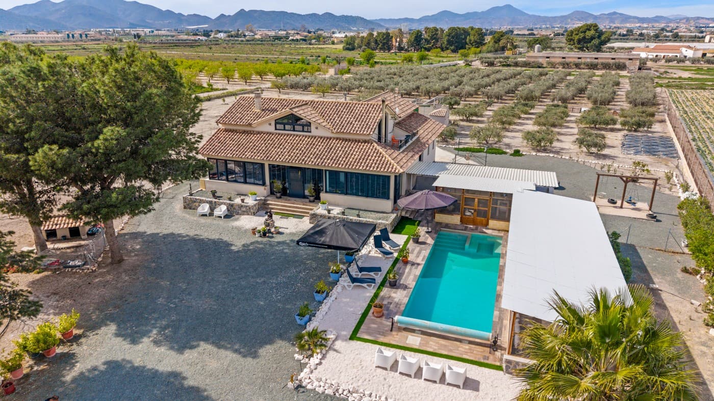 Unique Commercial Opportunity in Puerto LumbrerasThis exceptional property is ready to visit and to turn your plans into reality. Whether you are looking for a spacious family home or a place with business potential, this finca offers versatility, privacy and endless possibilities, making it ideal for entrepreneurs.Set on an impressive plot of more than 8,300 m², the estate features a modern villa complemented by a highly functional underbuild. The space, layout and distribution make it suitable for both residential and commercial use.On the ground floor, you are welcomed by a bright and generous living area with an open-plan fully equipped kitchen, creating a comfortable and social heart of the home. There is also a large storage room, three spacious bedrooms and modern bathrooms, all designed for practical and relaxed living.Upstairs, the property offers a beautiful private studio with its own living and sleeping area, a bathroom and access to a terrace with spectacular open views. This space provides ideal privacy for guests, extended family or even rental opportunities.The true hidden gem of the property is the expansive underbuild. With its original layout, it currently offers four additional bedrooms, a storage room, a fully equipped kitchen and a living area, all connected by an internal patio or multi-purpose room. This level opens the door to countless possibilities, from guest accommodation or staff quarters to a retreat centre, rental business or independent living area.Outside, the villa continues to impress. The grounds include a private garage, a BBQ area and a stunning 12 x 4 metre swimming pool. There is also a closed lounge area with an exterior kitchen and shower, perfect for entertaining or enjoying long summer evenings. The extensive plot is beautifully complemented by olive and fruit trees, enhancing the Mediterranean atmosphere.Located less than 30 minutes from the beach and only 5 minutes from local amenities, the property combines accessibility with peace and tranquillity. Surrounded by nature, it offers privacy without isolation.This is a rare opportunity to acquire a property that blends space, flexibility and strong investment potential in one of the most peaceful areas of Puerto Lumbreras.