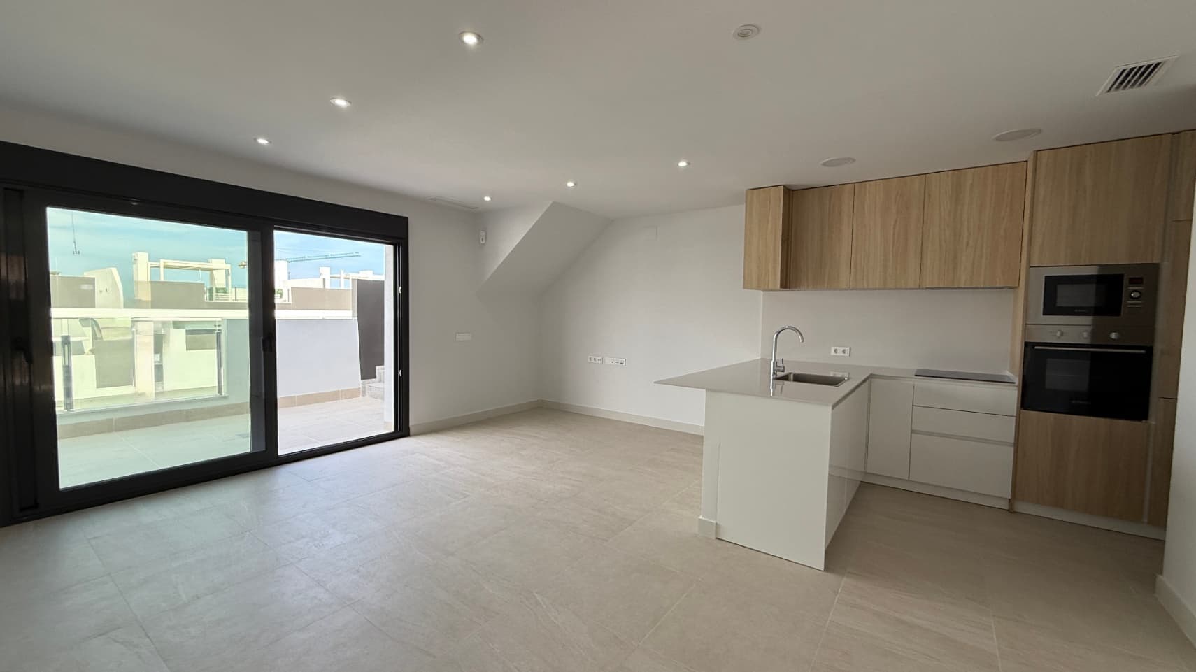 Located in the captivating city of Torrevieja, this modern apartment promises to be the ideal retreat for those seeking a comfortable and relaxing lifestyle. With a built area of 115 m² and usable space of 110 m², every corner of this home has been designed to maximize space and natural light.Space DistributionThe apartment features 2 cozy bedrooms, perfect for enjoying the tranquility and rest you deserve. A well-distributed bathroom provides functionality and comfort. The open-plan kitchen seamlessly integrates with the living room, creating an open and welcoming atmosphere, ideal for sharing moments with family or friends.Enjoy the OutdoorsOne of the great charms of this apartment is its 22.80 m² terrace, a perfect space to enjoy the Mediterranean climate. Imagine relaxing with a cup of coffee in the morning or hosting outdoor dinners while enjoying the views. The east orientation ensures you can enjoy the sun during the morning hours, filling your home with light and warmth.Amenities and ServicesThe community in which the apartment is located offers a communal pool, ideal for cooling off during the warm summer days. Additionally, the building features parking for your convenience and is designed with a modern style, providing not only aesthetics but also functionality in the distribution of its spaces. The good communications with the main access roads make navigating the city quick and comfortable.A Place to Call HomeThis apartment in Torrevieja represents not just a housing option, but a lifestyle in a vibrant environment full of opportunities. Nearby cities, natural beauty, and an enviable climate make this property a place where your dreams can come true. The Costa Blanca is known for its recreational and relaxation possibilities, offering a range of activities and attractions to enjoy year-round.Don’t miss the opportunity to live in this magnificent apartment that, more than just a physical space, is a home filled with potential and warmth.