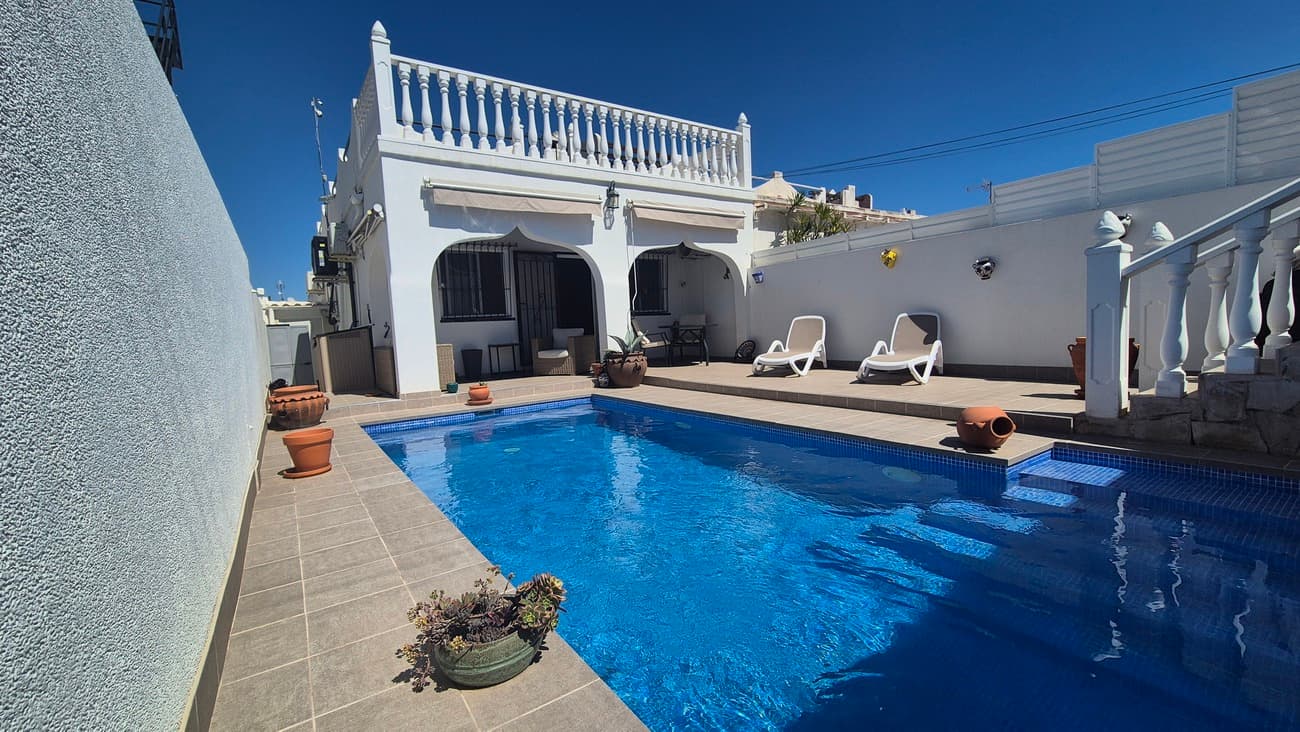  We present to you with this impressive 2 bedroom, single-story bungalow, with roof solarium and heated saltwater pool, complemented by solar panels to enhance energy efficiency. Conveniently situated, it is a mere 8 minutes from the bustling Villamartin - 10 minutes to the La Zenia Boulevard area, Beaches, Golf courses, and the popular Zoco Market.  This property is just 8 minutes drive from Villamartin, on the outskirts of the village of San Miguel De Salinas The owner has renovated the property over the last two years.The renovation includes:New Metal Fencing to the boundary of the propertyNewly built - HEATED and Covered - SALT WATER Swimming Pool to ensure all year round swimming. The pool has steps entery and a seating area at one end, the full width of of the pool.Newly tiled patio/terraceFreshly painted exterior to the house and boundary wallsNew Gas BoilerSOLAR PANELS – with Solar wallet to supplier and giving free ElectricityRefurbished BathroomRefurbished KitchenInternal walls Plastered to smooth finishNew fitted wardrobe to the main bedroomNew Air-conditioning units running also from wifi if required, allowing you to remotely start on a timer or immediately, from anywhere. Ideal if out and wanting a cool home to return to.New Remote controlled Ceiling FansImagine yourself sitting in the garden of this Beautiful South Facing property, being able to swim, all year round in the Newly Built, Heated Salt water Swimming pool or just simply relaxing on the Terrace.Entering the property, you have a bright spacious lounge and semi open plan to the kitchen which leads onto a utility area, which houses the Washing machine, Dishwasher & Fridge Freezer.The rear stairs lead to the Solarium which currently is home to the Solar Panels. (The Solarium has views to the Salt lakes and offers the potential to be extended to add further bedrooms and bathrooms)There are 2 Large Bright Bedrooms and a refurbished Bathroom.To the side of the property is an external Brick Built Storage area. LOCATION: This Semi Detached property, is just an 8 minutes drive from Villamartin, on the outskirts of the village of San Miguel De SalinasSan Miguel De Salinas, is a multi National community. It is just a 10 minute walk from the Village of San Miguel, which offers Supermarkets, Bars, Restaurants, Shops, Schools and more. There is also a Bar, just at the end of the road of which the Villa is situated.There is a bus service just a 2 minute walk from the house, taking you into La Zenia and also Torrevija (links to the airport). Also a good local Taxi service.Villamartin - GOLF - La Zenia Boulevard and local Beaches & Zoco Market are just a 8- 10 minute drive from the property.Padal Courts, Tennis Courts, Petanque, 5 Min walk from the property.The Village has Community Football pitches & large Community Swimming pool To arrange a Viewing contact us now, before it´s gone!  
