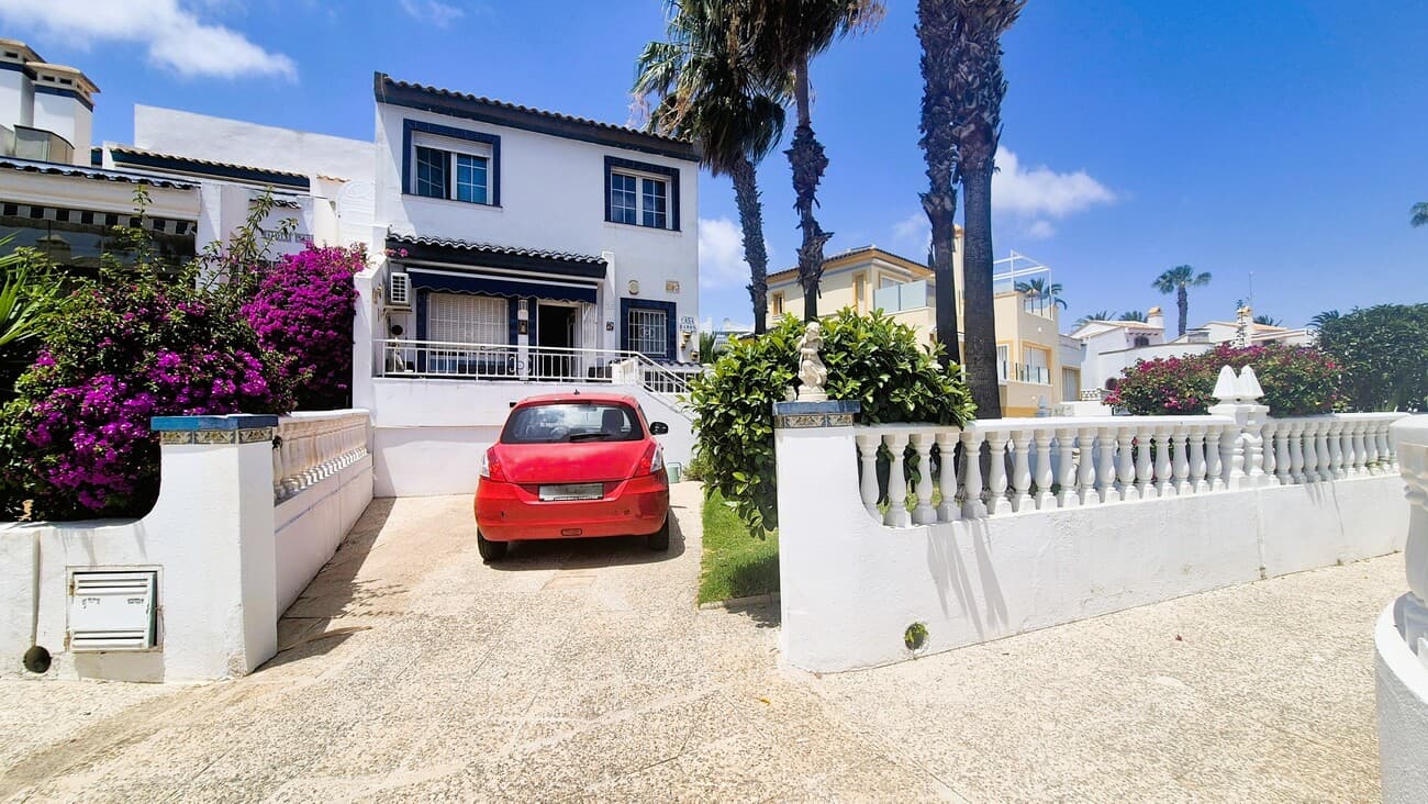  We present this 4 Bedroom Buhardilla Townhouse. It's a large, corner plot, South East facing and located in the very sought after area of La Rioja, Los Dolses.This townhouse is raised up a set of stairs, to the front Terrace,, ideal for the morning Coffee, views directly over the pool. Off road parking, Grass, Palmtrees, plants.The garden wraps around the house, offering a paved area at the rear of the property with more privacy too.As you enter the property into the Lounge Dinning area,  to the right is a fitted kitchen and separate utility area.You also have a Guest Bathroom with Bath tub and shower.Further back, are 2 double ground floor bedrooms, with fitted wardrobes. One of the bedrooms has access to the rear garden.Upstairs you enter the 2nd Lounge area with feature ceiling.  There is a Shower room.to the front of the house, are 2 more double bedrooms, both with fitted wardrobes.The property has Air Conditioning and a Pellet BurnerLocation:This property is located with just a short walk from La Fuente, Los Dolses both of which have many many, bars and restaurants. Many shops and supermarkets.La Zenia Boulevard and Villamartin Plaza are both within easy reach as is the Beautiful beaches of Orihuela Costa, Costa Blanca5 minutes drive to the Beach - 50 Minutes to the Airports, Alicante and MurciaNote:The property is in need or some renovation and the house has been priced accordingly.The upstairs could be re designed, by moving the bathroom to the top of the stairs and then a larger 5th bedroom to the right *back of the houseThis property is in a prime location for a family home, or, as a Rental. Tourism,  subject to obtaining a Tourist Rental Licence.You will find it hard to locate a house of this size, 4 bedrooms, with off road parking, views over the community pool and in a sought after location like this, for less than €300,000. So if you want to view, don't wait! 