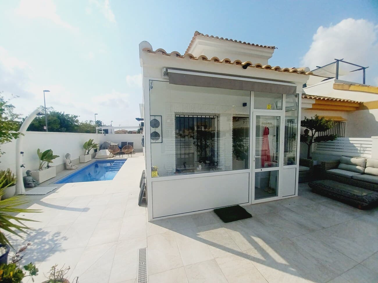 This stunning corner villa really has it all; set in a quiet residential street next to countryside and yet just a short walk to the traditional Spanish town of Sucina.  The villa enters into  a corner plot garden with plenty of terrace space and a salt water swimming pool, the terraces are tiled to a high standard with modern tiles, a dining area with awnings and a lounge area with high quality wicker terrace furniture.  The villa enters into a light and bright living room with open plan kitchen has been remodeled to a high standard and with high end white fitted kitchen, black tiling spash backs with full electrodomestics.  The living room is tastefully furnished with sofa, fitted cupboards a high quality newly fitted wood burner and airconditioning.  There is a hallway that leads to 2 double bedrooms; The first bedroom to the font of the villa comes with fitted wardrobe and a sofabed.  The rear bedroom has a a double bed and airconditioning.  The bathroom has been remodeled to a high standard with a bath/ shower, vanity unit, storage cupboard, heated towel rail and wc.  There is a side doorway from the garden leading to an inner patio area with stairwell leading to an upper terrace.  The upper terrace leads to a further studio double bedroom with double bed, storage unit, fitted wardrobe, air conditioning  en suite bathroom with shower, wc and sink.  There is a private upper terrace with high quality storage built in  and space  to enjoy spectacular views over the countryside.   This house has high surrounding walls for privacy and is situated next to a park and countryside offering privacy, peace and quiet yet with access to all amenities in Sucina village just 5 minutes walk.  Situated just 20 minutes drive from the airport and the coast, this villa is highly recommended for viewing.