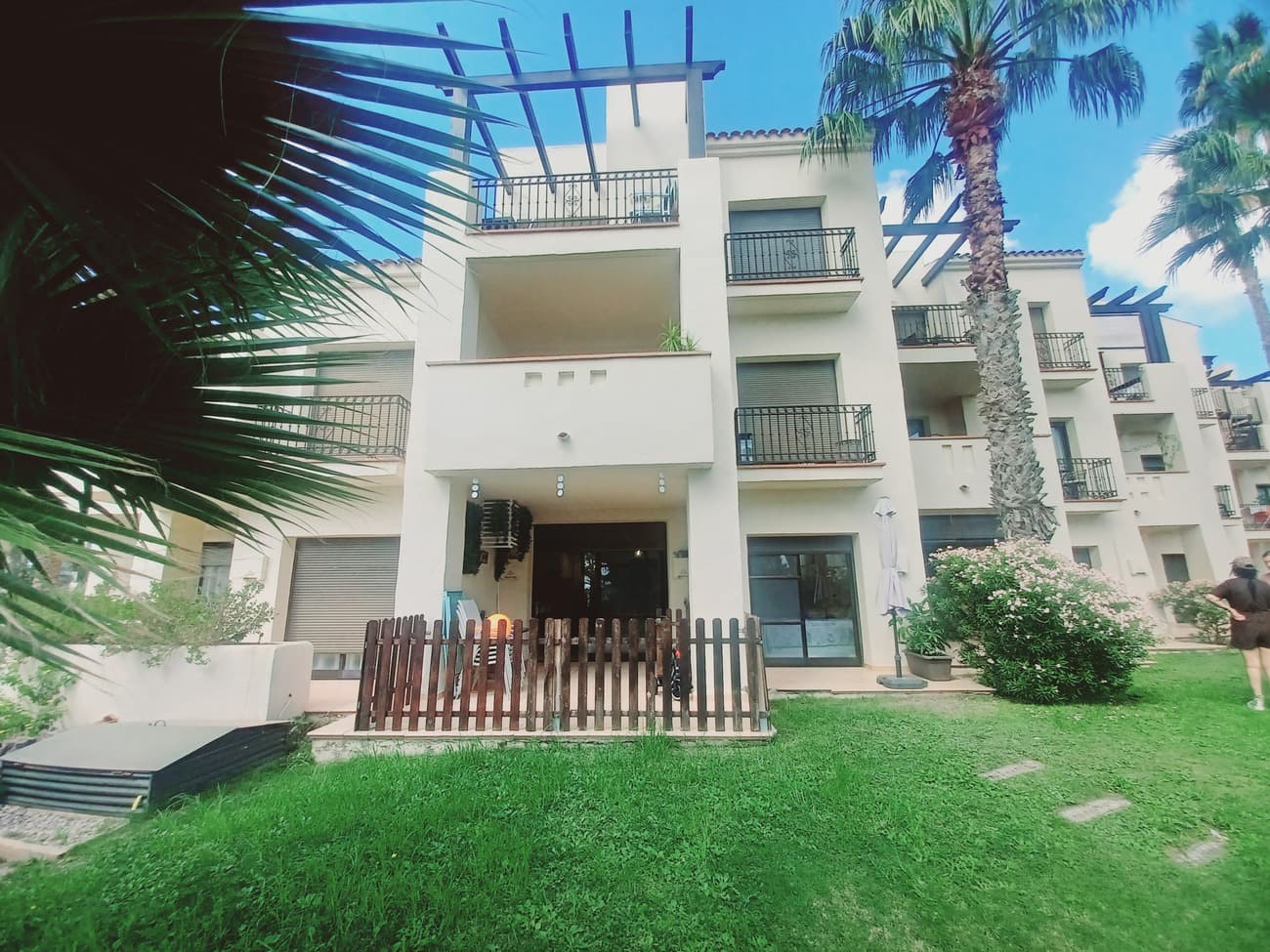 This beautiful ground floor garden apartment offers luxuary spacious living overlooking gardens with pool nearby in Roda Golf Resort.  The apartment enters into a beautiful living and dining room with features including marble flooring, high quality L shaped sofa, storage units, dining table and chairs and air conditioning with patio doors overlooking the terrace and gardens.  The terrace is east facing for morning sun and south facing to the side; it is mainly covered and it is spacious; it is tiled throughout with natural terracotta tiles and surrounded by wooden fence.  The ideal space for enjoying sunshine and eating outdoors.  The kitchen comes with fitted kitchen, hob, oven fridge freezer and washing machine.  There is a hallway off the living room leading to 2 double bedrooms; the first bedroom to the front of the apartment comes with double bed, bedside cabinets fitted wardrobes and patio doors overlooking a bedroom terrace with direct access outside.  It has an en suite bathroom with vanity unit, wc and bath tub with shower.  The second bedroom at the rear of the apartment  comes with a built in dressing room, a double bed and headboard with bedside cabinets and window.  The main bathroom is between the bedrooms currently with a wc and vanity unit.  This apartment is situated near the main security gate for easy access, it comes with underground parking, 24 hour security, communal gardens and pools and many other facilities.  The resort offers a great golf course and restaurant.  Just a short walk to Roda village and close to Los Alcazarez with many supermarkets, restaurants and great beaches.  This apartment is in very good condition, it will be sold fully furnished and is highly recommended for viewing.