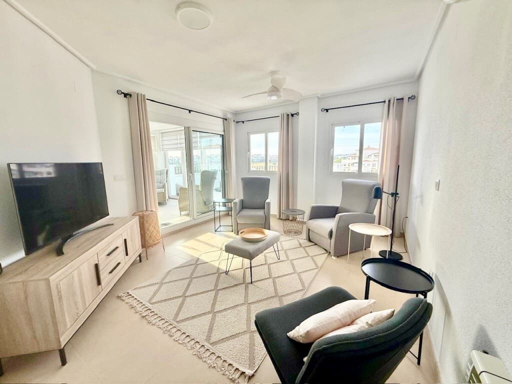 South west facing fully upgraded penthouse apartment with frontline golf views, located on the gated community of Hacienda Riquelme Golf resort with 24 hour security and only a short walk to the on-site restaurant, coffee shop, supermarket and 19 communal swimming pools. The apartment is been sold fully furnished and viewing is highly recommended to fully appreciate this beautiful apartment. A few minutes drive from the local town of Sucina with plenty of ameneties and bar/restaurants on offer.Ideally located to explore all the Costa Calida has to offer including the ancient towns of Murcia and Cartagena20 Minutes drive from Corvera Airport.55 Minutes drive from Alicante Airport.On entering this light filled penthouse you can instantly appreciate how the owners have lovingly renovated to a high standard throughout and used bespoke furnishings and modern furniture.The kitchen with separate additional seating area and panoramic views is one of the largest on resort with modern high gloss units, high quality work surfaces and white goods, leading through to an open doorway with concertina fly screen with additional storage and high table and chairs, ideal for looking at the stunning views why enjoying a cafe con leche. windows fitted with night and day blinds.All doors have been upgraded to white and it really does make the apartment look bright and fresh. The hallway has an additional storage unit which houses the wi-fi router and fuse board.To the left off the hallway is a guest bedroom with en-suite, it incorporates a window again with amazing views, white sliding door fitted wardrobe, new air-conditioning unit, ceiling fan light, vertical radiator and bespoke fold down double bed which can be used when you have guests or put away giving you options to use for an office etc. the modern en-suite has a pocket door entrance, is fully tiled and has a shower cubicle with shower, vanity unit and basin with led mirror above, toilet with wall mounted douche tap and heated towel rail and extractor fan.The modern fully tiled good sized main bathroom has been fitted with a fantastic walk in shower screen and tray, overhead rainfall shower and riser rail and inset shelf, extractor fan, vanity unit with led mirror, inset toilet and flush plate with seperate douche tap, inset shelf and heated towel rail.The master bedroom has white fitted sliding door wardrobe, ceiling fan light, radiator, new air conditioning unit and patio doors with mosquito screens leading out onto the terrace room.The lounge with two windows and sliding patio doors has bespoke made to measure curtains, a new air-conditioning unit, ceiling fan light and led light, and radiator and great views of the lake and golf and modern furniture.Part of the terrace has been converted into a room with large storage cupboard, vertical radiator, spotlights and ceiling fan light, quality flooring and benefits from night and day blinds, dining table and chairs perfect for dining while taking in the beautiful views or watching the amazing sunsets, sliding windows and bi-fold doors have been fitted so you can open them up in the hotter months and close them in the cooler months.  The outdoor fully tiled terrace is amazing for entertaining, sunbathing, and enjoying the views of Sucina, the mountains, golf course or communal gardens.The entrance hall has been fitted with a glazed door, giving you privacy.The apartment comes with a remote entry allocated garage space and private storage unit.