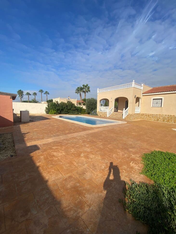 Discover this beautifully presented villa located in the charming town of Catral, offering comfort, style, and fantastic outdoor living spaces.The property features a private 8x4m swimming pool surrounded by a spacious sunbathing area, outdoor kitchen, and a lovely landscaped garden — perfect for entertaining or relaxing in the sun.Inside, you’ll find a large, bright living room with a log burner and patio doors leading directly to the pool area. The separate kitchen comes fully equipped with brand-new appliances, while the main bathroom includes a bath with shower over.There are three double bedrooms, all fitted with brand-new ceiling fans and built-in wardrobes in the master and second bedrooms. The master suite also benefits from its own private ensuite bathroom.Additional features include:Ducted air conditioning throughoutGarage for one carStorage roomAutomatic entrance and pedestrian gatesSpacious 49m² roof solarium with lovely views over Catral and DoloresLarge wrap-around naya providing shaded outdoor living spaceThis villa perfectly combines indoor comfort with outdoor charm — ideal as a permanent home, holiday retreat, or investment property.