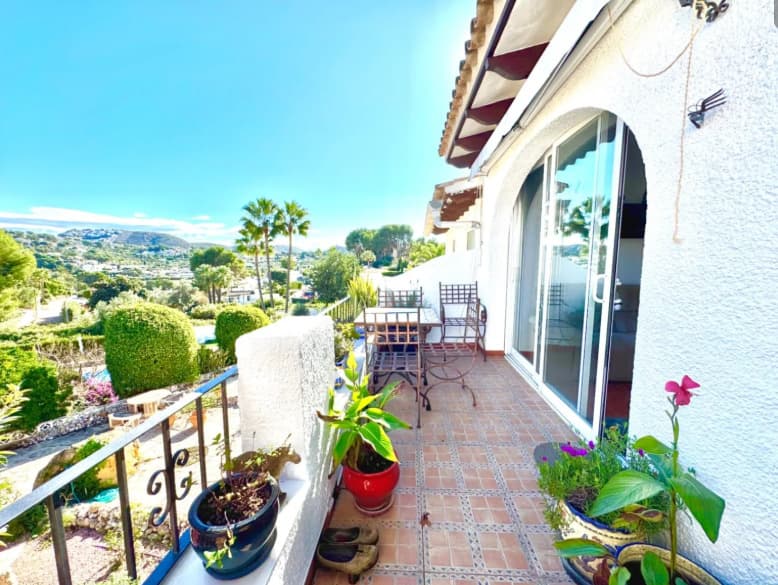 A delightful duplex townhouse only 1.8 km from Moraira centre. set on a small and incredibly pretty complex of 13 houses with a communal pool and beautiful gardens. Within only 500–600 m you’ll find the wonderful Tabaira area, where you can walk to restaurants, a supermarket and local services. This makes the home ideal either for everyday living or holiday use.On the main floor, there is an entrance room, currently used as a study, then entry to the large open plan living/dining area with a balcony of 6 x 1.5 metres, with amazing views a good size kitchen with a breakfast bar.The lower floor has 2 double bedrooms, one with access to the spacious outside garden, perfect for relaxing and a BBQ entertaining area. A full bathroom and a shower/guest toilet. Plus, a third room without windows to use as storage or as another bedroom. The property has aluminium double glazing throughout, air conditioning and faces East for ample sun!The plot is around 300 m2, and the house is 100 m2 with parking included.To conclude, this is a stunning traditional property on a small and beautifully peaceful complex in one of the most desirable and affluent areas of Spain. Perfect for use as a lock-up and leave holiday home or all year round living. Contact us to arrange a viewing as it will sell quickly!