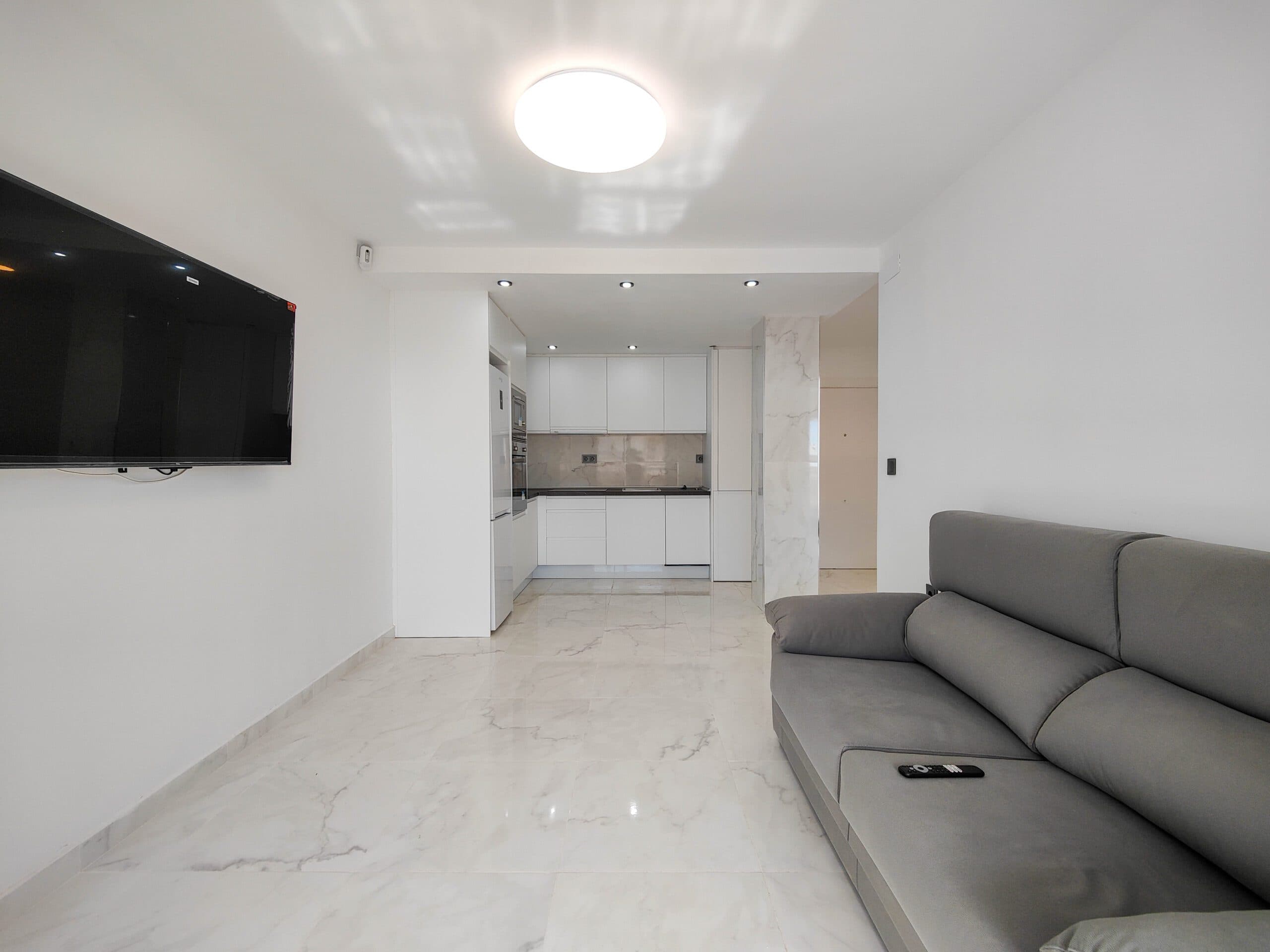 Beautiful completely renovated south facing apartment with views over the swimming pool for sale in Rocío del Mar - Punta Prima - Torrevieja. Located in a building with elevator, covered and fenced parking for residents and a huge communal swimming pool with lifeguard. Very well kept building, recently reinforced.This wonderful apartment has been completely renovated, including electrical installation and plumbing, ready to move into.The apartment has 2 large bedrooms with fitted wardrobes and access to the terrace, 2 bathrooms (both with shower), a bright living / dining room with a beautiful brand new integrated kitchen.The bedrooms and the terrace enjoy an excellent SOUTH orientation, which gives them a lot of natural light. From the terrace we have unobstructed views over the communal pool, ideal for keeping an eye on the children.Privileged location, a few steps from the bars, restaurants, supermarkets and the beaches of Punta Prima.Do not miss the opportunity to buy this beautiful completely renovated south facing apartment with the best orientation and on the best location in Punta Prima!