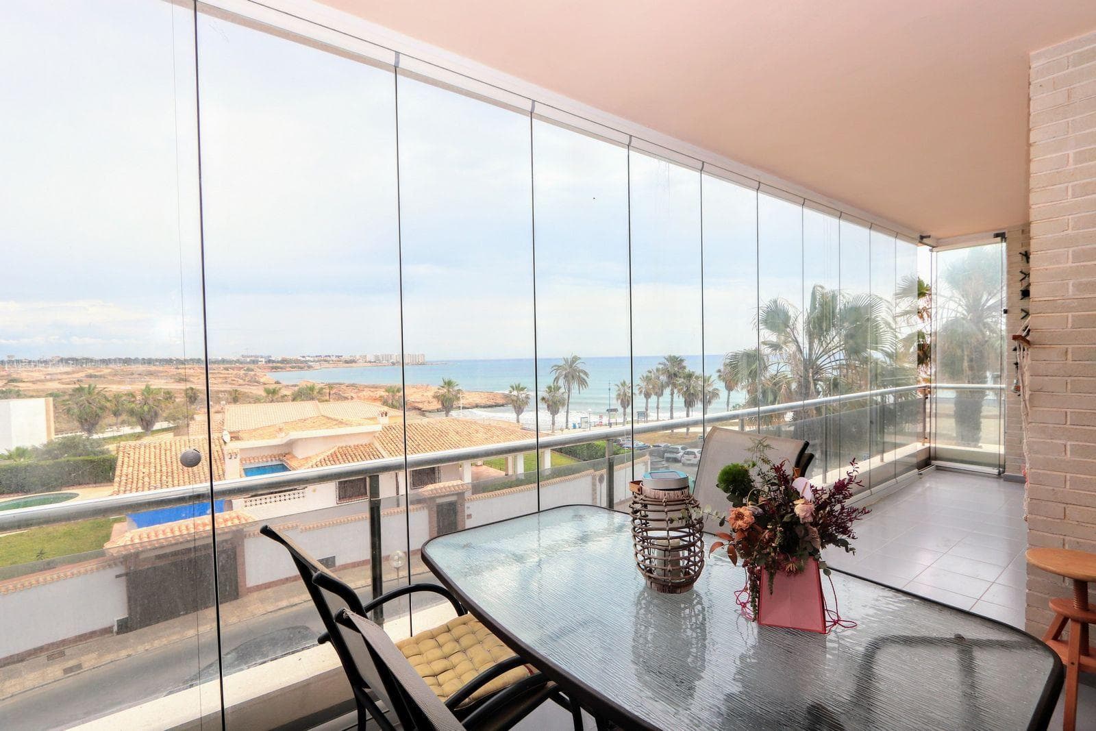 Stunning frontal sea views from large terraceSecond floor apartment for €349,900Discover this spectacular beachfront apartment, a unique opportunity for those who value a privileged location and unbeatable views. Located on the second floor, the property offers stunning sea views that can be enjoyed both from inside and from its large terrace, making it the perfect place to relax, have breakfast or watch the sun rise over the Mediterranean. 120 metres from the beach.The property has approximately 135 m² distributed over 3 spacious bedrooms, 2 full bathrooms, a bright living-dining room and a fully equipped separate kitchen. The east-facing orientation guarantees excellent light throughout the morning, bringing warmth and well-being to the spaces.The apartment is located in a recently renovated residential complex that includes a communal swimming pool, green areas, new lifts and accesses adapted to current regulations. It is also equipped with air conditioning to ensure maximum comfort throughout the year.Its location in Playa Flamenca is another of its great attractions. It is just a short walk from supermarkets, restaurants, cafés and all kinds of services, and very close to the Zenia Boulevard shopping centre, one of the largest in the province with a wide range of shops, leisure and dining options.The area also offers numerous leisure and tourism activities blue flag beaches, internationally renowned golf courses such as Villamartín, Las Ramblas and Campoamor, water sports, hiking trails, natural parks and local markets, such as the Saturday market.Playa Flamenca is one of the most sought-after areas of Orihuela Costa, perfect for a permanent residence or investment. Don´t miss the opportunity to live with exceptional sea views and all the comforts this magnificent property has to offer.IBI €340Price €349,900.
