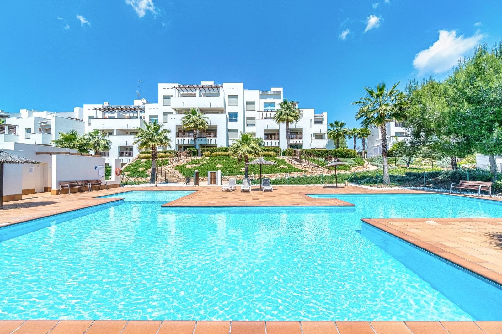 ve the privilege of Las Colinas Golf Country Club in Orihuela CostaImagine waking up every day surrounded by Mediterranean nature, in one of the most exclusive residential resorts on the Costa Blanca. This elegant 191 m² apartment at Las Colinas Golf Country Club combines luxury, comfort, and a strategic location to offer you a unique lifestyle.The warm and functional layout connects all the rooms seamlessly spacious living room, modern kitchen, 3 bedrooms and 2 bathrooms (including master suite), plus a stunning 40 m² terrace with open views of the landscape. The perfect space to enjoy outdoor dining or simply relax in peace.The property includes a private parking space with direct access, storage room, built-in wardrobes, heating, and air conditioning. Built in 2013, it remains in excellent condition within a secure gated community with landscaped gardens and a communal pool. Unparalleled Natural SettingThe community features two private swimming pools, one of them integrated into the forest, where you can fully enjoy the calm and exclusivity that Las Colinas is known for. The surrounding landscape is truly unique Mediterranean vegetation, walking paths, and an atmosphere of serenity that is hard to find elsewhere.The location is another highlightOnly 40 minutes by car from Alicante International Airport.Fine sandy beaches such as Campoamor, Cabo Roig, and La Zenia are just 15 minutes away.Shopping centers, restaurants, and first-class services within 10 minutes.And, of course, direct access to one of Spains most prestigious golf courses.With southeast orientation, this home enjoys the best natural light all year round, creating a welcoming atmosphere in every season. This is more than an apartment its your gateway to a peaceful and exclusive oasis on the Costa Blanca.IBI (Property Tax) €457.32Community Fees €193.99 per month