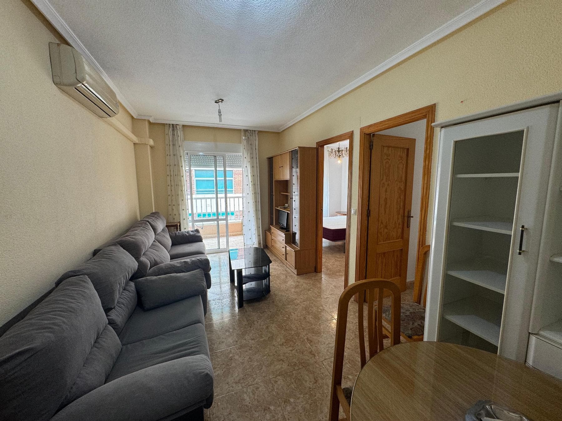 Your New Home in Torrevieja Move-In Ready ApartmentImagine waking up every morning with the Mediterranean sun filling your home. This third-floor apartment, with southeast orientation, is designed to enjoy natural light all year round and take advantage of the unbeatable climate of Torrevieja, with more than 320 sunny days annually.With a surface area of 64 m², the property is ready to move into no renovations, no complications just bring your suitcases and start your new life.Key Features Surface 64 m² 2 spacious bedrooms 1 full bathroom Open-plan kitchen connected to the living room 5 m² terrace with southeast orientation Move-in ready Acequión Beach only 80 m away Los Náufragos Beach just 150 m awayIts location is simply perfect surrounded by supermarkets, pharmacies, restaurants, bars, and shopping centers, you will have everything you need just steps away. Plus, its only 40 minutes by car from Alicante International Airport, making it an excellent choice as a permanent residence, holiday home, or investment.The Blue Flag beaches of Torrevieja such as Playa del Cura and Los Locos are just minutes away by car, while Acequión and Los Náufragos Beaches can be reached on foot, perfect for enjoying the sea without needing a car.Nearby, youll also find the Natural Parks of La Mata and Torrevieja, famous for their stunning pink salt lagoons, and within 10 km you have golf courses, marinas, and cultural routes that make this city a complete lifestyle destination.Torrevieja offers not only sun and sea, but also quality of life a cosmopolitan city with excellent infrastructure, vibrant atmosphere, year-round activities, and that Mediterranean charm that captivates everyone. Price €129,990Dont miss the chance to own this home in the heart of the Costa Blanca!