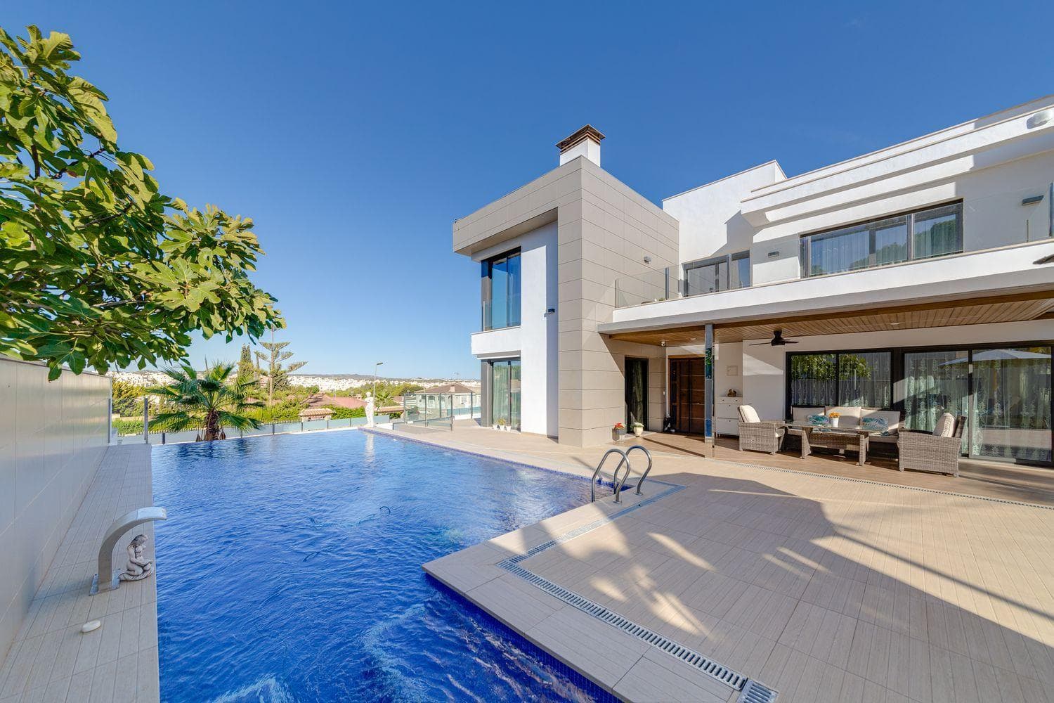 A contemporary gem designed for those who seek excellence, absolute comfort, and impeccable aesthetics. This unique villa combines cutting-edge technology, spaciousness, and top-tier finishes in one of the most prestigious areas of Torrevieja.Key features 3 bedrooms 4 bathrooms 461 m² built area 790 m² plot Private pool with waterfall Hammam in the master bathroom Private gym Parking space for two vehicles Smart home system Eighteen solar panels Underfloor heating throughout the property Fully equipped kitchen with premium appliances Monthly SUMA tax €90On the ground floor, there is a spacious social area with a fireplace, a separate living room, and a surround sound system. Underfloor heating ensures comfort all year round. The fully equipped kitchen includes high-end appliances. All spaces are integrated into the homes smart system, and the bathrooms feature built-in radios and NOKEN finishes.The upper floor offers four exceptional bedrooms. The master suite includes an en-suite bathroom with a private hammam, while the additional bedrooms each have their own bathroom and built-in wardrobes. A large elevated terrace with a shower provides the perfect spot to relax in the sun.The basement houses a gym, a multi-purpose room ideal for a home cinema, storage rooms, and technical areas.Outside, the pool with waterfall and its terrace area invite you to enjoy the Mediterranean lifestyle.5 minutes from La Zenia Boulevard and 7 minutes from the beach. Alicante and Murcia airports are just 45 minutes away.