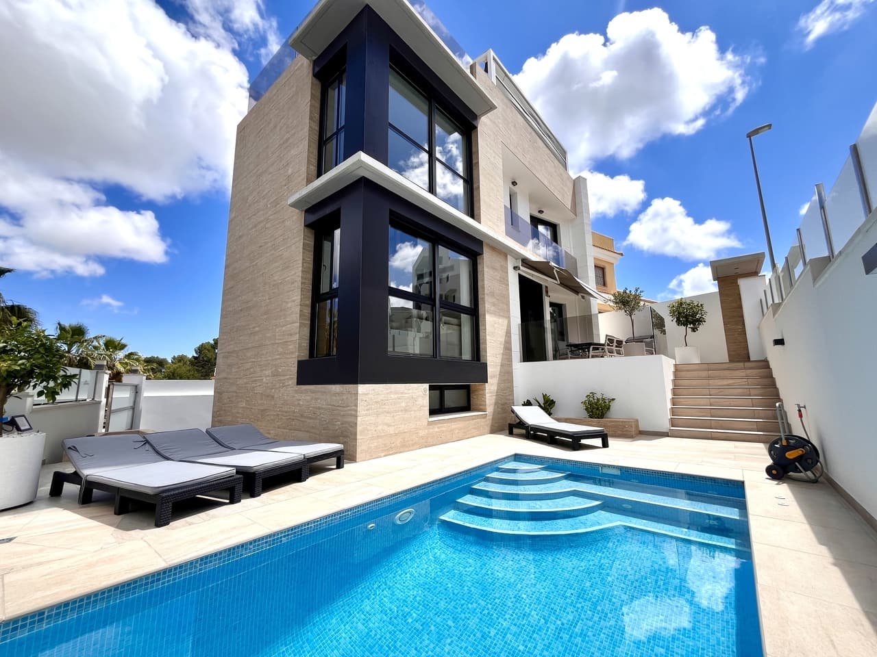 A fantastic modern 3 bedroom luxury villa on a large corner plot in the very sought after area of El Galan, Villamartin, Alicante close to all local amenities, several golf courses, lovely white sandy beaches and the popular La Zenia Boulevard shopping centre. The property boasts a bright living/dining room, a modern open plan fully equipped kitchen, three bedrooms with fitted wardrobes, three bathrooms, air conditioning (hot/cold) throughout the property, LED lighting (interior/exterior), a large garden with a private swimming pool, a private rooftop terrace/solarium with sea views, and a very handy underbuilt/garage.Close to several golf courses, La Fuente commercial centre and a short drive to the lovely white sandy Orihuela Costa beaches, with plenty of bars, restaurants, and amenities on your doorstep, this is the place to be!