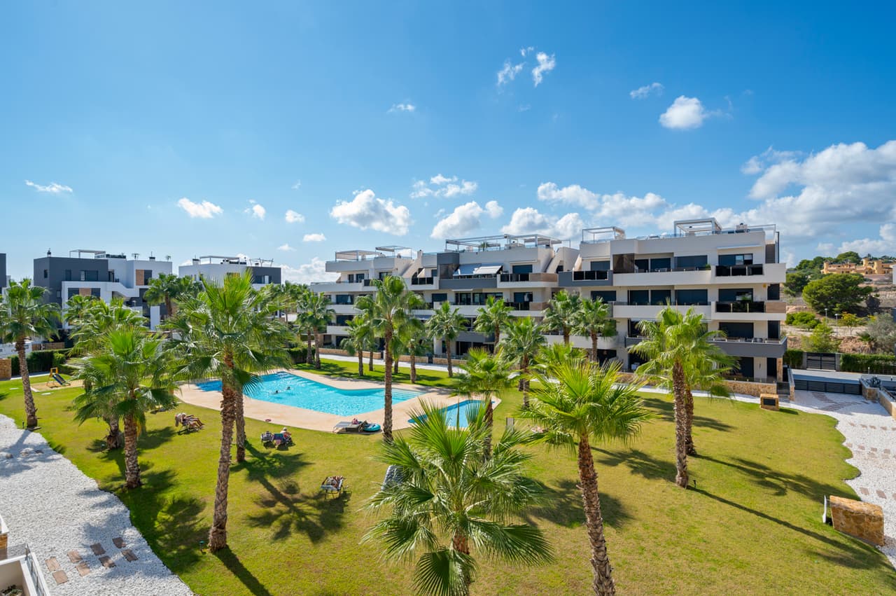 This modern luxury second floor corner apartment with 2 bedrooms and large private terrace is situated in the very sought after area of Villamartin, Alicante (Orihuela Costa)The property will be sold fully furnished and consists of a spacious lounge/dining room area, a modern open plan fully equipped kitchen, two bedrooms with fitted wardrobes, two bathrooms (one is en-suite), patio doors from the lounge also lead out onto a private terrace to enjoy the Spanish sun all day. Parking space and storage room in the underground garage is included in the price as well.All residents of this development have use of the indoor gym and the Spa&Wellness area, a very beautiful landscaped communal garden with swimming pool and jacuzzi, children’s playground.Set in a great location with stunning views, you are only a few minutes walk away from the famous Villamartin Plaza with local restaurants, bars and shops to cater for all tastes and needs. The fantastic sandy beach of La Zenia is only a 10 minute drive away.