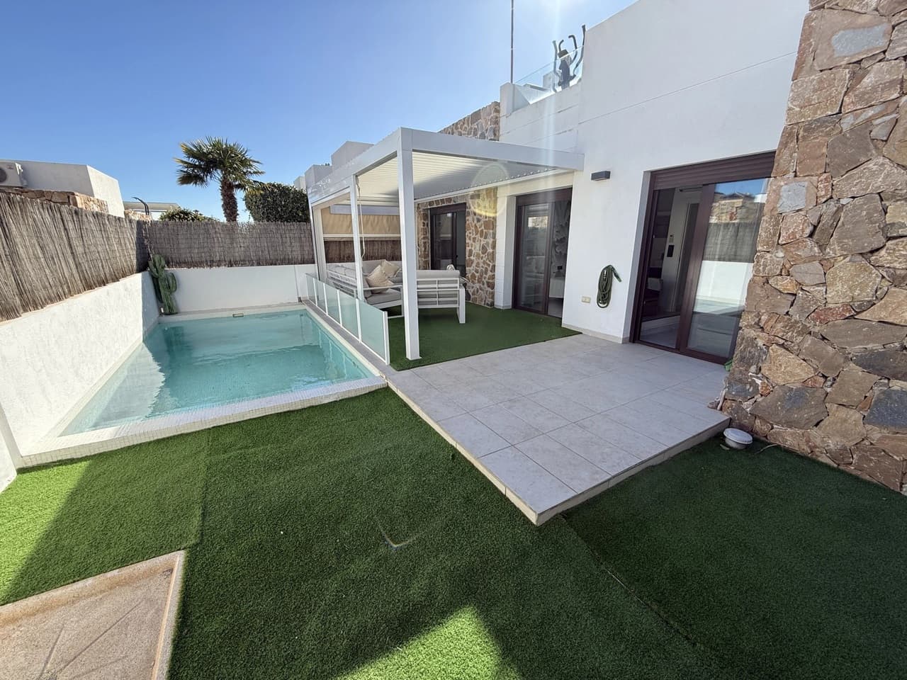 Discover this beautifully presented single level detached villa (2017) located in the highly sought-after area of Lomas de Cabo Roig (Orihuela Costa), Alicante. This modern villa offers a bright open plan living/dining area with direct access to the terrace and private swimming pool area, ideal for entertaining or relaxing in the sun, a modern open plan fully equipped kitchen, air conditioning (hot/cold) throughout the property, three bedrooms with fitted wardrobes, two bathrooms (one is en-suite), a storage, a private rooftop terrace/solarium and off road parking.Ideally situated within walking distance to all amenities including restaurants, bars, supermarkets, and shops, and just a 5-minute drive to the lovely sandy beaches of Cabo Roig and Campoamor, this property offers the perfect blend of comfort, convenience, and Mediterranean living.
