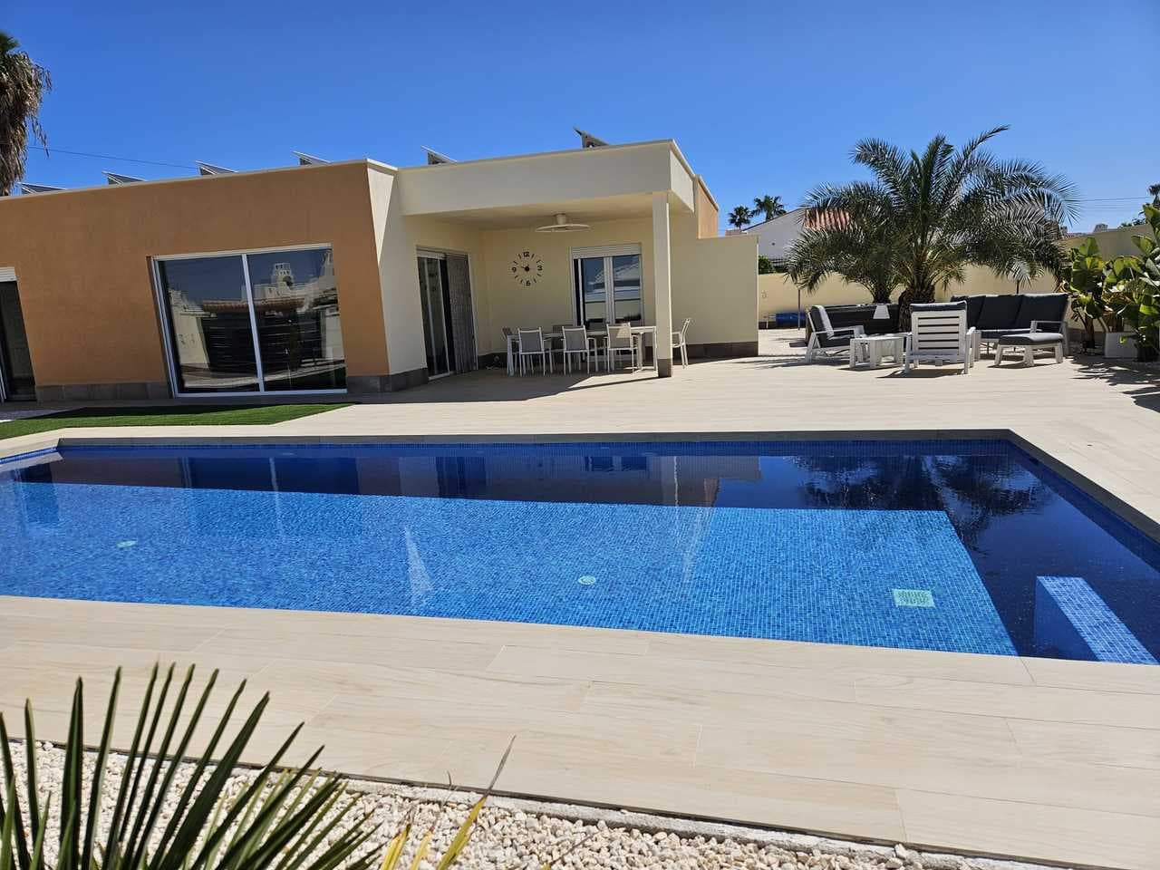 Beautiful detached 4 bedroom villa on an 800m² plot, with a garden and a private swimming pool in La Torreta, Torrevieja, Alicante.The main house has a living/dining room with an open plan fully equipped kitchen with a dishwasher, oven, Siemens induction hob and large refrigerator. The kitchen is right next to a large 150m² terrace. There are four bedrooms and two bathrooms.Behind the main house is a 63m² small house currently used as storage, but previously it had a living/dining room, kitchen, a bedroom and a bathroom. The main house has air conditioning in each room.There are 30 solar panels on the roof and a 15Kw battery. The electricity bill is 0€.Outside there are two large terraces with a large swimming pool (10x4,5), next to which is a jacuzzi and an outdoor shower with hot water.There is also a large porch to park a car out of the sun, an alarm system inside the house but also on the outside. Also CCTV system and doorbell that is linked with your smartphone.
