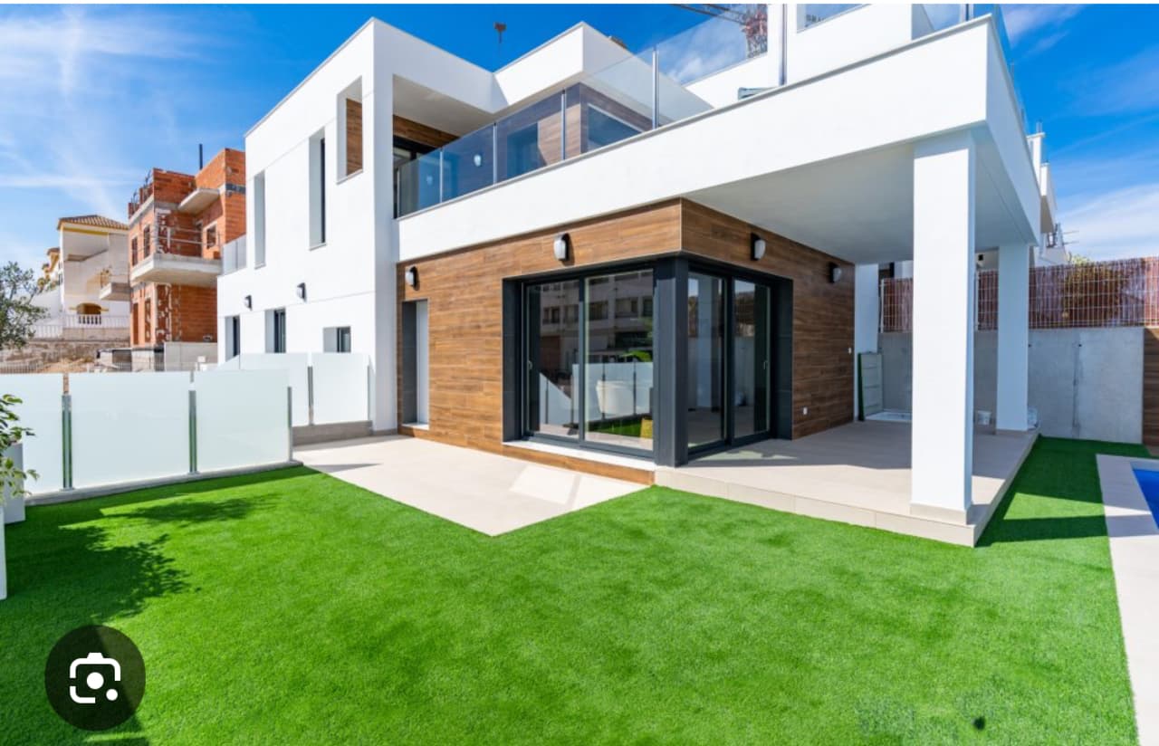 This beautiful modern corner villa with 3 bedrooms, private swimming pool and summer kitchen is situated in VistaBella Golf, Alicante.The property consists a spacious living/dining room, a modern open plan kitchen, three bedrooms with fitted wardrobes, three bathrooms (two are en-suite). Upstairs, the master suite offers plenty of space, an en suite bathroom with dressing room and a private terrace with breathtaking views - ideal for relaxing. All windows with electric shutters, underfloor heating in the bathrooms. Electric shutters and awning with sensor, fully equipped outdoor kitchen with induction cooker, extractor hood, refrigerator and freezer, as well as grill. Large private swimming pool with fully automatic salt system with Redox and automatic filling. Pool heating/cooling so you can swim at 30 degrees all year round. Special filter for drinking water throughout the house, solar on the roof with inverter/battery and feed into the grid. Electric gate with remote control and space for 3 cars. Whirlpool, furniture etc. may be taken over. (Negotiable)An exclusive property on the Costa Blanca that combines design, technology and comfort, with all amenities such as ATM, supermarket, bakery, various restaurants and bars, pharmacy etc. can be viewed, with the advantage that it is a fully secured zone with 1 entrance and exit via a security post. The license plate of each car is electronically registered. The 18-hole golf course (Par-72) extends over 6,000 meters and with its hilly fairways, strategic bunkers and picturesque lakes is one of the most pleasant and challenging courses in the region.Several hospitals including private clinics within 15 minutes. Alicante International Airport 50 KM away. The AP 7 motorway is only 5 minutes away.