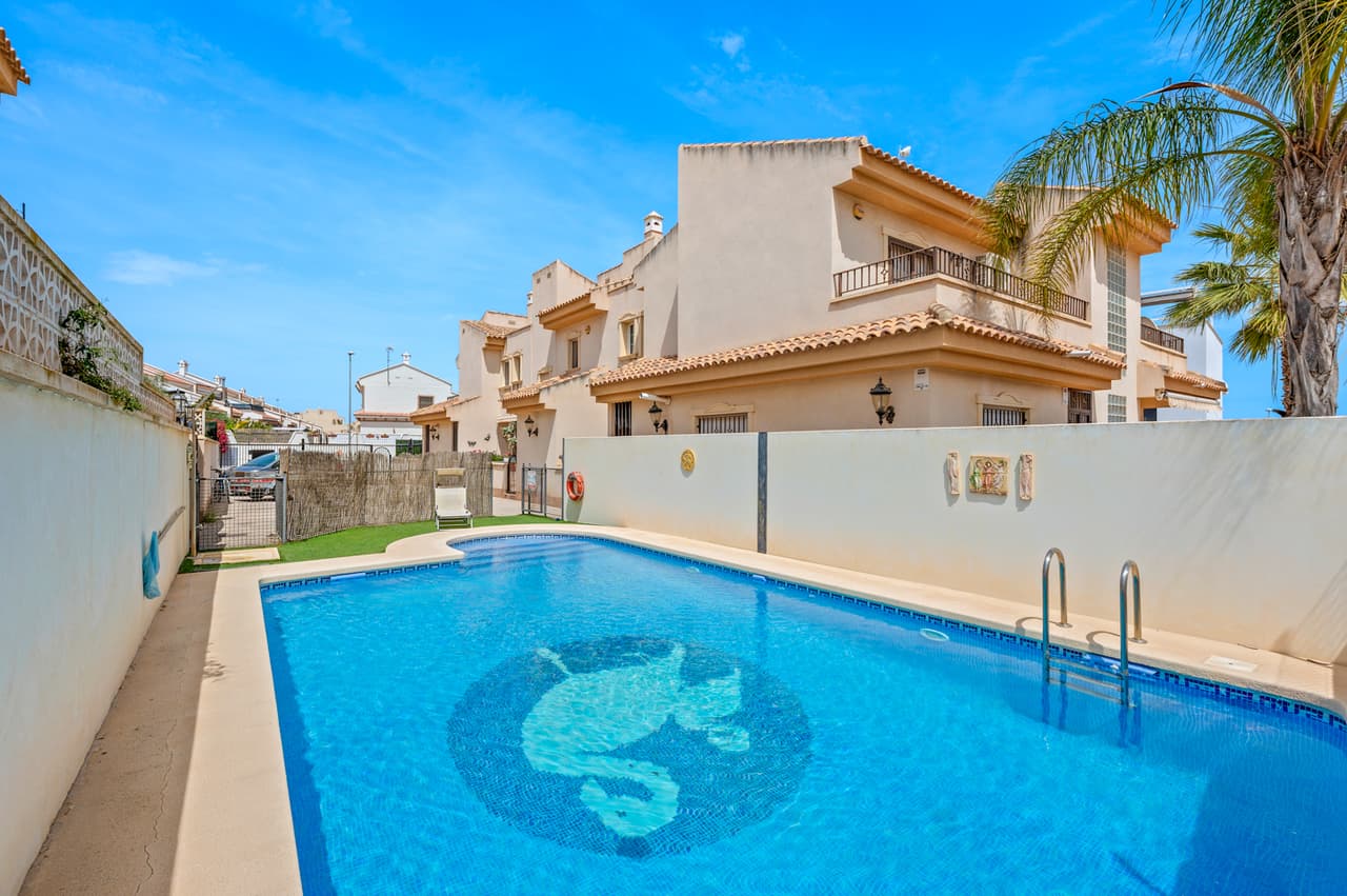 This lovely presented 2 bedroom townhouse with underbuilt is situated in San Miguel de Salinas, Alicante close to the city centre with plenty of bars, shops, restaurants, and several golf coursesThe property consists of a spacious bright living/dining room, a modern fully equipped kitchen, two bedrooms with fitted wardrobes, one bathroom with bathtub, a utility room, air conditioning (hot/cold) throughout the property, and a very useful additional underbuilt with another bedroom with dressing room, and a bathroom.It has a front terrace with access to the gated off road parking area and the communal garden with swimming pool.