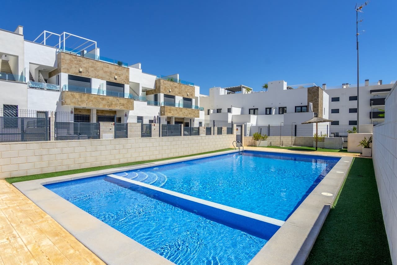 This modern 3 bedroom townhouse is located in Villamartin, Alicante on the gated development of Don Benito within a community of 27 properties. Set in a great location situated only a few minutes walk from the Villamartin Plaza which has a great choice of restaurants, bars and shops. The ground floor is comprised of a lounge/dining area, an open plan kitchen with utility room, a bedroom and guest bathroom. From the lounge there are patio doors leading out into a private garden and terrace. There is also the option to have a private swimming pool. The first floor consists of a master bedroom with en-suite bathroom, another double bedroom with en-suite and patio doors leading onto a private sun terrace. There are stairs leading to a private solarium to enjoy the all day sun. There is a communal garden area with heated swimming pool. This is a beautiful high quality townhouse, set in a great location close to all amenities and is just a short drive to golf and the sea. The Villamartin area is very popular with tourists and most of the population consists of Western European expatriate communities who have settled there in the last 10 years, virtually transforming the village into a modern-looking town. There are also many golf courses nearby and numerous beaches.