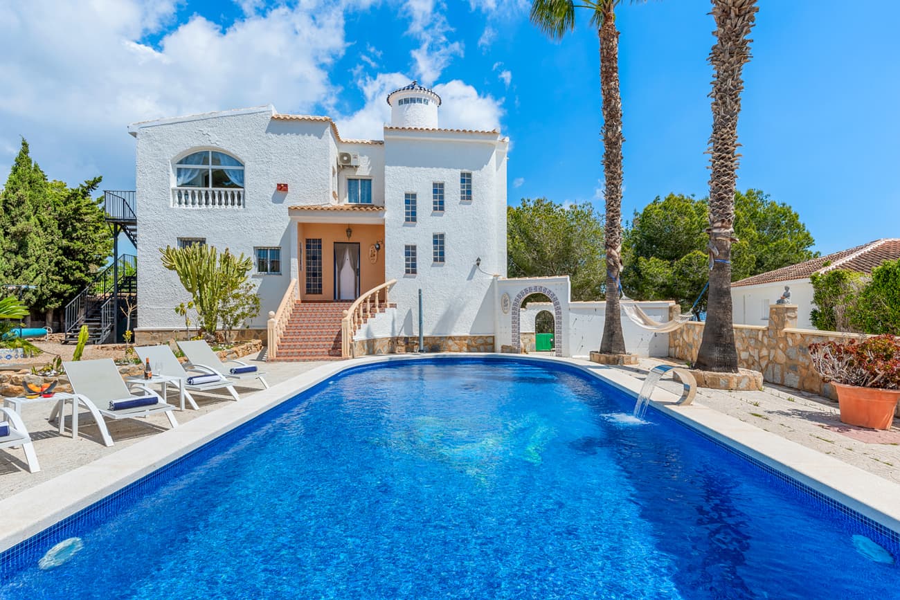 For sale: an exceptional villa in Pinar de Campoverde (Ref: YC9101), offering both luxury and investment potential.This property features 4 spacious bedrooms and 3 modern bathrooms, a 13x5m private swimming pool with a waterfall and starry-sky effect, and a solarium with panoramic views of the sea and surrounding mountains. The villa sits on a beautifully landscaped 1100m² plot, ensuring complete privacy and plenty of space for outdoor living. Multiple terraces, both sunny and shaded, create the perfect setting for relaxation, entertaining guests, or enjoying family time.Inside, you will find a bright and inviting living area, a fully equipped kitchen, and direct access to the garden and pool area. The property combines comfort and elegance, making it suitable as a permanent residence, a family holiday retreat, or an attractive rental investment.An important advantage of this villa is that it comes with a current and active rental license, which allows the new owner to rent the property legally and immediately generate income. This makes it a highly desirable option for investors looking for returns in one of Spain’s most popular coastal regions.Located on the Costa Blanca South, the villa is close to the cities of Alicante, Murcia, Torrevieja and Cartagena, as well as the Mediterranean beaches just a short drive away. The area offers excellent infrastructure, international airports, golf courses, and year-round sunshine.Ref: YC9101 – A rare opportunity to own a luxury villa with proven rental potential on the Costa Blanca.