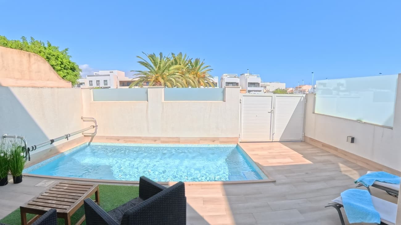Modern, bright villa with heated private pool in San Pedro del Pinatar. This magnificent & immaculate villa has 3 bedrooms and 2 bathrooms - one of bedrooms on ground level. Well-designed villa provides to You a lot of natural light to rooms but also gives a possibility to enjoy a shadow during hot summer days. And very open sunroof is very private. This is true round-a-year -villa. On the ground floor of the villa you will find a bright and spacious living room opening onto the pool area. On this floor you will also find a spacious and fully equipped kitchen, a spacious bedroom and a magnificent bathroom with a window and underfloor heating. From 1st floor You can find 2 very bright bedrooms with built-in wardrobes and bathroom with window & underfloor heating. A balcony is front of villa. Both floors are equipped with a ducted air conditioning and solar powered air ventilation when You are not at home - always fresh inner air.The villa has a 36 m2 sun terrace on the roof, from where you can also admire a bit of the sea.The heated swimming pool in the private yard is 5.0 x 2.5 m in size. As a nice addition, there is a hot/cold shower and a Finnish electric sauna on full tiled yard. There is a large city park in front of the villa and therefore the houses opposite are quite far away. 