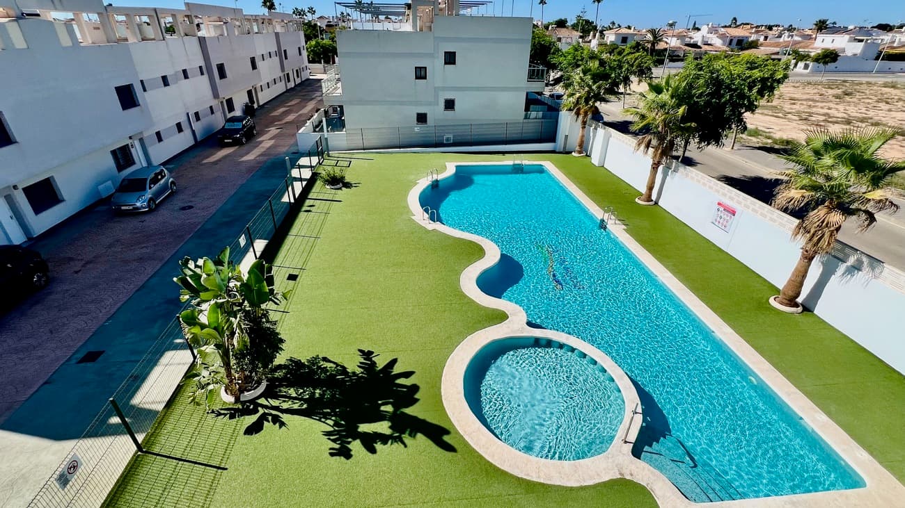 Beautiful 2 bedroom, 2 bathroom top floor end unit apartment with a large sunroof located in the Mil Palmeras urbanization. Built in 2016 with top quality materials, it is sold fully furnished and ready to move into. The apartment has a spacious living room with an open kitchen, very bright, with access to a balcony from all rooms. It also has a large private solarium with a sea views. Two full bathrooms and one is en-suite. Apartment is 66 m2 with large south side windows.It is located on the first floor with access by stairs and includes a private parking space with ready-made vehicle charging option. The residential complex offers well-maintained common areas and a communal pool, in a modern, clean and quiet environment, within a consolidated and well-kept neighborhood. Nearest beach is after some 300 m and Mil Palmeras services are some 5 minutes walking distance. Video presentation available in YouTube. 