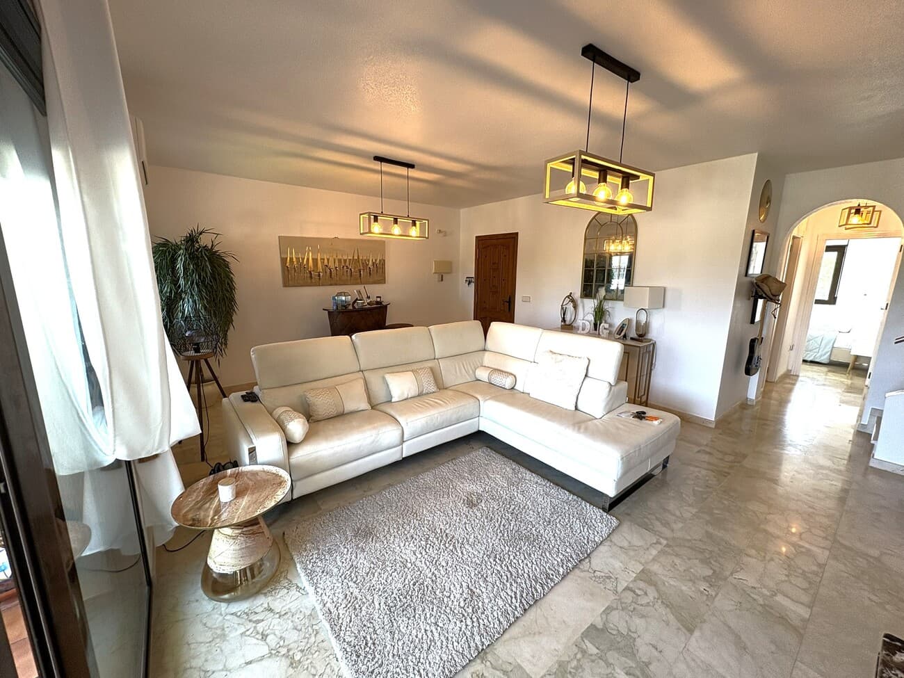 This stunning 3 bedroom, 2 bathroom 130m2 duplex apartment offers a truly unique opportunity to own this superb home on the much sought after urbanisation of Las Ramblas on the Orihuela Costa.A rare first floor ‘duplex’ style penthouse apartment, this fabulous property spans two storeys and occupies an enviable position overlooking the beautiful communal pool and manicured gardens, enjoying spectacular countryside views across the costa.  Recently refurbished, this well appointed, part furnished apartment offers the discerning buyer a touch of luxury with marble floors and air conditioning throughout and a location which is second to none – this property really must be seen to be fully appreciated.On the first floor, the entrance opens onto a bright and spacious living/dining room with a fully equipped galley style open-plan kitchen combining to create a real sense of space and openness. There’s also a lovely natural open fireplace for those cosy evenings when the sun’s gone down.  A large family bathroom, two large double bedrooms and a really useful under-stairs storage room offering that all important hiding place for the essentials complete the first floor accommodation.  The living/dining area offers a great space for entertaining with the added benefit of full-height patio doors which lead out to a large 12m2 terrace enjoying panoramic views over the gardens, communal swimming pool and across the Orihuela countryside.  The large BBQ and dining area make this the perfect spot to enjoy your cheeky evening vino and tapas whilst soaking in those views.Both of the first floor bedrooms benefit from full height wardrobes and plentiful space for guests, whilst climbing the stairs takes you to the superb second floor master bedroom suite.  This expansive double bedroom area enjoys plenty of storage space with wardrobes running the full length of the room and a surprisingly large luxury en-suite bathroom off the main accommodation.  However the real ‘wow factor’ of this exceptional space becomes clear when you wander out through the large double patio doors onto the incredible rooftop solarium.  Measuring circa 38m2, this sun drenched terrace offers a truly spectacular spot to relax, unwind and enjoy the year-round Spanish sunshine.  With plenty of space to accommodate the large bali-style sunbed and dining area, there is also an outdoor shower to cool you down after a day basking in the Costa Blanca sunshine.  And then there are those spectacular views…..you could simply never get bored of looking out at that vista.The property also benefits from a private allocated underground parking space and secure lockable storage room.Location, quality and value combine to make this property a truly exceptional prospect for anyone seeking the ultimate home with easy access to all that the Costa Blanca has to offer – walking distance to the best bars, restaurants and shopping and only a few minutes drive from the Mediterranean and those golden beaches – what more could you want?