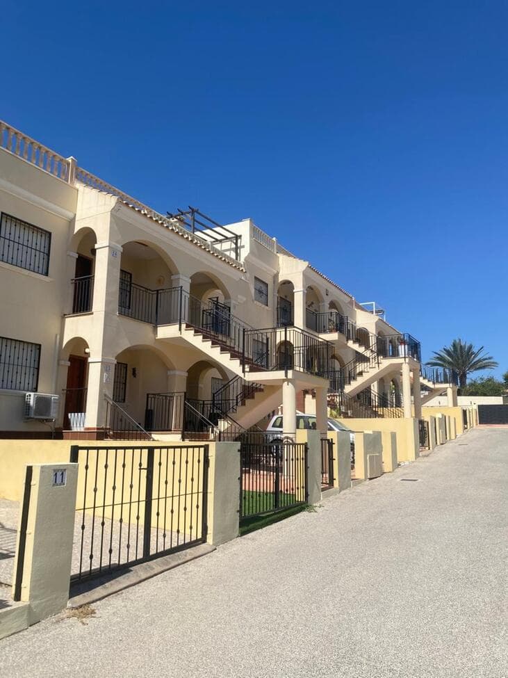 Algorfa (Montemar)2 Bedroom Ground Floor Flat with an artificial grassed terrace both at the front and rear of the property.This apartment is located in the Montemar Urbanization of the town of Algorfa, Alicante.It has a build size of approximately 56m2.The Apartment is ready to move into. Perfect as either a holiday home or as a permeant residence.Furniture is partially included.This flat is housed within a gated community, and has an electric gate operated key fob at the entrance.Communal Pool and Tennis Court.This home is about a 20-minute walk or a 3-minute drive to all the local amenities, such as restaurants, shops, and bars.Just a 20-minute drive to the coast (Guardamar del Segura).