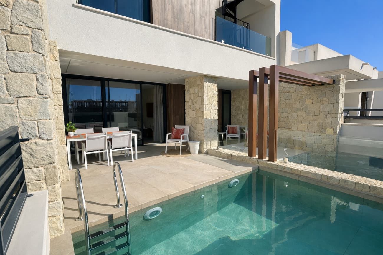 This modern and fully furnished townhouse was completed at the end of October 2025 — and no one has ever lived in it! It combines the elegance of new construction with the comfort of being completely key-ready, waiting for its first owner.Property Highlights•⁠ ⁠Living area: approx. 163 m²•⁠ ⁠3 bedrooms and 3 bathrooms (including one ensuite)•⁠ ⁠Master bedroom with walk-in wardrobe•⁠ ⁠Private pool with built-in LED color lighting•⁠ ⁠Large solarium with pergola, mountain views, and solar panels•⁠ ⁠South-west orientation for all-day sunshine•⁠ ⁠Completely furnished – every piece of furniture is brand new!•⁠ Energy Certificate : AStep inside and you’ll immediately feel the bright, open atmosphere of this contemporary home.The ground floor features a spacious open-plan living and dining area with a modern kitchen and direct access to the terrace and private pool – perfect for entertaining or relaxing under the sun. You’ll also find a full bathroom, a patio, and a laundry area with washing machine and dryer.Upstairs, there are three comfortable bedrooms and two bathrooms, including the ensuite in the master. One of the bedrooms also opens onto a private terrace with access to the rooftop solarium.The solarium is equipped with a pergola, solar panels, and outdoor furniture, offering stunning mountain views. There’s also plenty of space to install a summer kitchen or barbecue area, creating your own rooftop oasis.The huge basement offers endless possibilities: it can be converted into a home cinema, guest apartment, gym, man cave, or simply used as additional storage space.Surroundings & Location:This home enjoys a privileged location in a peaceful residential area of Dolores:•⁠ ⁠A beautiful park with outdoor gym, flowers, and birdlife is just 3 minutes away.•⁠ ⁠Municipal pool, padel and tennis courts, and a local bar are only a 2-minute walk.•⁠ ⁠Town center: 2 minutes by car•⁠ ⁠Supermarket: 3 minutes by car•⁠ ⁠Alicante Airport: 33 minutes•⁠ ⁠Beaches: 20 minutesThis property offers all the advantages of a new build — pristine condition, modern design, energy efficiency — without the wait. Everything is finished, furnished, and ready for you to move in immediately.A rare opportunity to own a brand-new, never-lived-in villa with all the modern comforts, perfectly located between the countryside and the Mediterranean coast. 