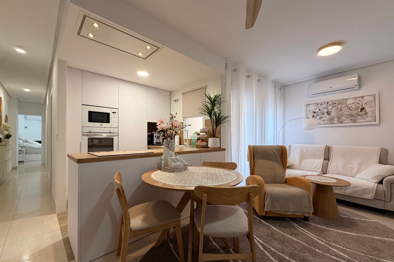 SPACIOUS AND VERY BRIGHT APARTMENT FULLY RENOVATED IN 2025, LOCATED AT PLAZA DE CALVARIO IN TORREVIEJA, RIGHT NEXT TO PARQUE DE LAS NACIONES. ✨ KEY FEATURES OF THE PROPERTY:Built area: 84.10 M²3 bedrooms, 2 bathrooms – one main bathroom and one en suite2 balconiesfirst floor with liftfully renovated in 2025 ‼️ READY TO MOVE IN IMMEDIATELY!The apartment is sold fully furnished (excluding the TV, washing machine, dryer and the orange armchair) ✅ EQUIPMENT:fridge, oven, microwave, extractor hood, ceramic hobair conditioning in the living room and the master bedroom ✅ LAYOUT AND STANDARD:living room with an open-plan kithen and access to a balconyU-shaped kithen, fully equippedmaster bedroom with en suite bathroom and private balconytwo additional bedrooms, one currently used as a dressing room / home officesecond, independent bathroombright, cohesive finishes in a modern style ☀️ BALCONIES AND ORIENTATION:balcony in the living room and the master bedroom with east-facing orientation – morning sunnatural light and pleasent indoor climate throughout the day ✅ LOCATION – TORREVIEJA, PLAZA DE CALVARIO:➡️ 5 minutes’ walk to Parque de las Naciones➡️ 10 minutes’ walk to the city centre➡️ 20–25 minutes’ walk to the promenade and Playa Del Cura➡️ 18 minutes on foot / 5 minutes by car to Habaneras Shopping Centre➡️ Quick access to the N-332 road and AP-7 motorway➡️ shops, restaurants, services and bus stop nearby  CONTACT US FOR MORE INFORMATION OR TO ARRANGE A VIEWING.