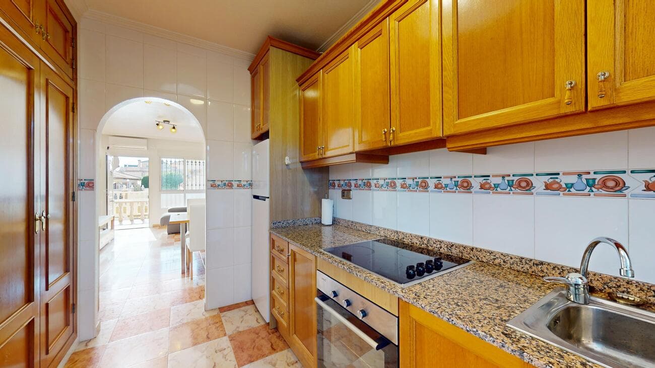 Charming ground floor apartment with large terrace Costa Blanca SouthThis cozy apartment in Torrevieja (Costa Blanca South) is the ideal place to enjoy sun, sea and a relaxed lifestyle. Located in a residential complex with communal pool, this apartment offers a combination of comfort, outdoor space and a convenient location.Features:Living area: 63.68 m² (according to deed)Bedrooms: 2 spacious bedroomsBathroom: 1Terraces: front about 8 m² (east facing) + back about 43 m² (west facing)Floor: ground floor (small building with only 2 floors above)Building year: 2003Communal swimming pool in the residenceParking: limited spaces within the complex (not allocated) + additional parking in the back streetCommon costs: only 400/yearIBI (property tax): 255.12/yearThe layout is practical with a bright living space, kitchen, 2 bedrooms and bathroom. The absolute plus are the two terraces: a cozy eastern terrace for morning coffee and a large western terrace of no less than 43 m² to fully experience the afternoon and evening sun.Thanks to its convenient location, you are a short distance from stores, restaurants, beaches and all necessary amenities. Ideal as a vacation home, investment or permanent residence under the Spanish sun. 