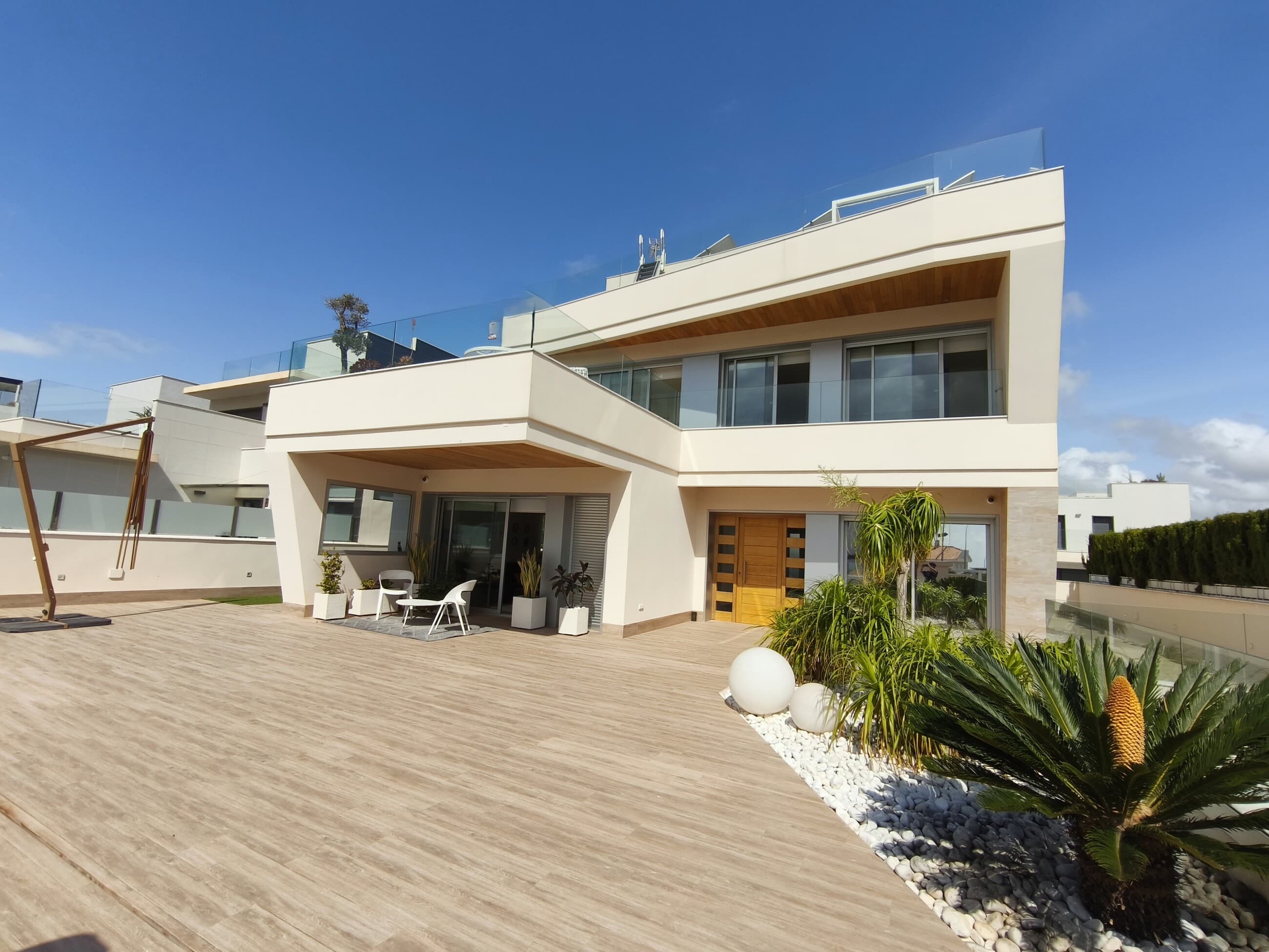Light, space, and well-being. Quality of life. These are the concepts that will accompany you when you visit this distinguished villa.Located in Dehesa de Campoamor, just steps from the Mediterranean coast and close to all the essential amenities for comfortable living, this property offers sea views from every room: the living room, all the bedrooms, and the terraces. The villa's garden features a heated swimming pool, perfect for year-round enjoyment.Built in 2019, the villa stands out for its contemporary design, spacious rooms, and abundant natural light. A convenient elevator connects the property's four levels. The home automation system offers advanced functionalities for managing and controlling the property's systems.The ground floor features a living room, kitchen, and dining area, harmoniously integrated into a single open space. One of the villa's four bedrooms is located on the ground floor and has an en-suite bathroom. The first floor houses the spacious, bohemian-style master bedroom, with access to the large terrace shared by the other three bedrooms. You'll wake up to the sun's rays caressing the sea outside your window.The two children's bedrooms, equipped with ample built-in wardrobes, are comfortable and inviting. They share a bathroom and have access to the communal terrace.A true delight awaits on the solarium with unobstructed sea views. Here you'll find a barbecue area, a relaxation zone, a table and chairs, and a romantic boudoir.It's worth noting the photovoltaic panels installed on the roof, which provide considerable energy savings.The basement level, in addition to providing parking space, offers several useful rooms: a Turkish bath (hamam), storage, a bathroom, a laundry area, a utility room, and an additional bedroom.Visit this villa and you'll fall in love with its charm.
