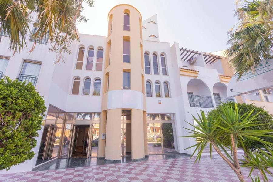 4-Star Hotel | 149 Rooms | Roquetas de Mar, Almería, SpainExcepcional opportunity to acquire a well-positioned 4-star hotel asset in one of Southern Spain’s most established and resilient tourist destinations.Located in the heart of Roquetas de Mar’s tourism district and just 700 metres from the beach, this hotel offers investors and operators the opportunity to secure a substantial hospitality asset with significant repositioning and value-enhancement potential in a market that continues to attract both domestic and international visitors year-round.Benefiting from its strategic location within easy reach of the town’s marina, seafront promenade, commercial areas, restaurants and leisure facilities, the property is ideally positioned to capitalise on the strong tourism fundamentals of the Costa de Almería.Prime LocationRoquetas de Mar is recognised as one of Andalusia’s leading coastal destinations, renowned for its year-round sunshine, extensive beaches, golf facilities, modern tourism infrastructure and growing international appeal.The hotel is conveniently situated close to key attractions including Santa Ana Castle, Roquetas Lighthouse, the marina and a wide range of retail, dining and entertainment options.Its location supports a diversified customer base encompassing leisure travellers, families, senior tourism, sports tourism and extended-stay visitors, providing a solid platform for long-term operational performance.Asset Overview•          4-Star Hotel•          149 guest rooms•          Plot size: 3,312 sqm•          Built area: 7,686 sqm•          Originally opened in 1992•          Last major refurbishment completed in 2002•          Efficient operational layout designed for hotel use•          Established position within a mature and recognised tourism destinationFacilities & AmenitiesThe property benefits from a comprehensive range of guest facilities, including:•          Outdoor freshwater swimming pool•          Spacious sun terrace with loungers and parasols•          Buffet restaurant•          Café and lounge area•          Poolside snack bar•          24-hour reception•          Laundry facilities•          Bicycle hire service•          Attractive communal leisure spacesGuest accommodation includes:•          En-suite bathrooms•          Air conditioning•          Satellite television•          Telephone•          Mini fridge•          Hairdryer•          In-room safeValue-Add and Repositioning PotentialThis acquisition represents an attractive opportunity for investors seeking to unlock additional value through refurbishment, modernisation and repositioning strategies.The combination of a sizeable room inventory, established location and existing hospitality infrastructure provides a strong foundation for asset enhancement, operational optimisation and long-term capital appreciation.Potential opportunities may include:•          Comprehensive refurbishment and upgrading programme•          Rebranding under an international or regional operator•          Conversion towards lifestyle, family or adults-only concepts•          Enhancement of food and beverage offerings•          Revenue optimisation through modern distribution channels and operational efficienciesInvestment Highlights•          Established 4-star hospitality asset•          Prime location within a leading Mediterranean resort destination•          Walking distance to the beach•          Strong tourism fundamentals and year-round appeal•          Significant repositioning and value-creation potential•          Attractive opportunity for hotel operators, investment funds, family offices and hospitality groups•          Located within one of Spain’s most resilient leisure tourism marketsThe OpportunityAs tourism across Southern Spain continues to demonstrate robust growth and investor demand for quality hospitality assets remains strong, opportunities of this scale and location are becoming increasingly scarce.This hotel presents a compelling investment proposition, combining an established operational platform with significant upside potential in a destination that continues to strengthen its position within the European leisure travel market.