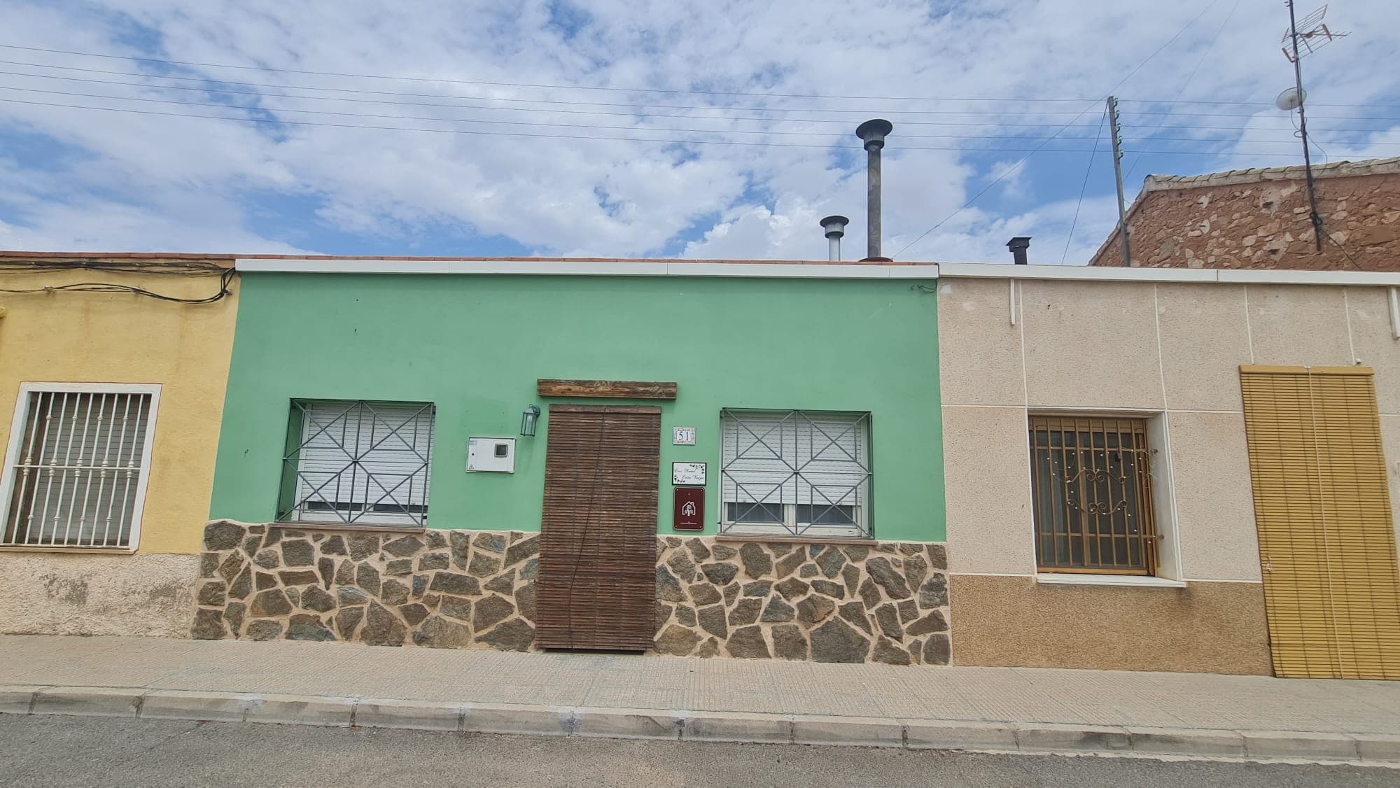 **Charming Village House Just Outside Pinoso**Nestled in a quaint village just minutes from Pinoso, this beautifully renovated mid-terrace house is the perfect blend of traditional charm and modern convenience. South-facing and fully renovated in 2021, this delightful property offers approximately 3 bedrooms, 1 bathroom, a spacious lounge with a cozy fireplace, and a well-sized kitchen that opens up to a private courtyard.The courtyard is a true gem, offering a peaceful retreat where you can unwind or entertain guests. It features a small plunge pool, perfect for cooling off during the warm summer months, as well as a covered BBQ area and an outdoor dining space—ideal for enjoying those balmy summer evenings with friends and family.A key feature of this property is the tourist license, which is included in the sale. This makes it an excellent investment opportunity for those looking for a holiday home that can also generate rental income. With its easy-to-maintain layout and low maintenance needs, this house is perfect as a "lock-up and leave" property.Additional conveniences include mains electricity, water, internet, telephone, and sewage. The property is also disabled-friendly, equipped with air conditioning for both heating and cooling, and includes a store room. With access from two roads, it's just a 5-minute drive to the town of Pinoso, where you'll find all your day-to-day amenities.This charming village house offers the perfect blend of tranquility and convenience, making it an ideal investment or your new home in the heart of the Pinoso region. Don't miss out on this unique opportunity!We have a large portfolio of properties in the Costa Blanca and Costa Calida areas, specialising in country properties, villas, fincas, building plots and design and build options in the Alicante and Murcia regions with a particular emphasis on Elda, Monovar, Pinoso, Sax, Villena, Aspe, Fortuna, Albacete and many more surrounding areas. We have been established since 2004 and have decades of experience between the team which we bring to bear to help you find and secure your new dream home. We help you every step of the way to make sure your purchase in Spain is safe and hassle free. We are not here to sell you a property, we are here to help you realise your dream and find what is right for you. With us you are in the safest hands. Contact us now to have a no obligation chat about how you too can realise your dreams.