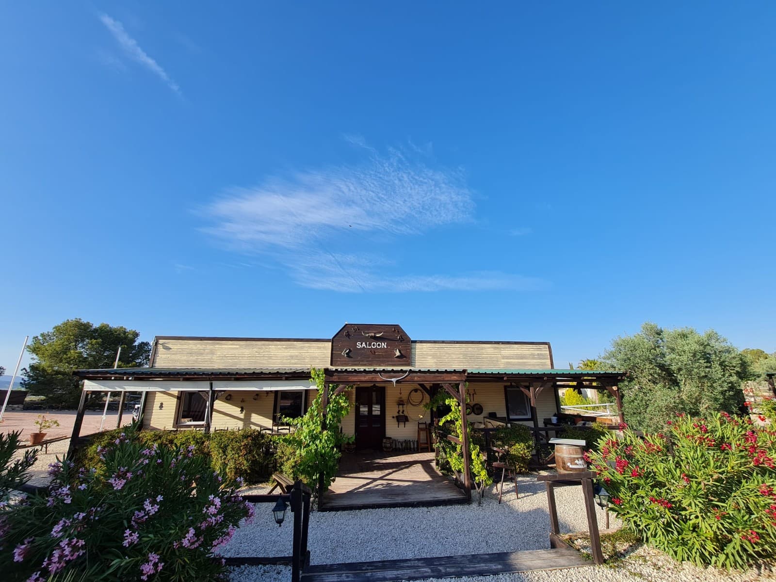 Exclusive Equestrian Estate with Private Residence in the Mountains of AlicanteLocated just five minutes from the town of Monòvar, this remarkable 3.7-hectare estate offers an exceptional opportunity for private living combined with professional equestrian facilities. Set in a peaceful landscape of pine forests, vineyards, and olive groves, the property boasts panoramic views of a picturesque valley, with the coast and Alicante Airport only 35 minutes away.The property is divided into two main areas: a private residential area and a professional equestrian centre, and the entire complex has been thoughtfully designed with well-kept paths, gravelled areas, white wooden fences and a variety of plants. A time-controlled irrigation system takes care of the green areas.Private living area: Main house with 165 m² of living space, single-level, ceiling height 3.5m 4 bedrooms, 3 bathrooms, kitchen, living room Central heating (oil), air conditioning Thermoglazed wooden tilt-and-turn windows with shutters and fly screens 2 sun terraces, a jacuzzi Partial basement (height 1.30 m) Sandstone facadePrivate Pool area: Illuminated pool with integrated filter system 85 m² covered chill area with fireplace Barbecue area with bar Outdoor kitchen Outdoor toilet and storage room Outbuilding for oil heating and tankEquestrian centre: Saloon building (approx. 150 m²) with outdoor terrace, bar, fitted kitchen and utility room Outdoor toilets 4 airconditioned guest houses with private terrace and shower roomPool area with sun loungers Stable building with 8 horse boxes (4x3 m each), 4 of which have outdoor paddocks Hay storage, Feed room Illuminated sand riding arena (20x40 m) Workshop and storage container with canopy and saddling area Fully insulated tack room 4 large group paddocks with automatic drinking troughs and electric fencing Separate living area for staffThe property has mains electricity supply, a 20 kW solar system and water connections across the entire site, including the paddocks. A REGA licence is in place to keep up to 17 horses.This ranch combines functional equestrian facilities with comfortable living spaces, all set against a stunning natural backdrop. Ideal for hosting guests or running an equestrian business, this property is a rare find. Experience the tranquility and beauty of mountain living while enjoying top-notch amenities for both you and your horses. About the Area:Monòvar is a charming town in the province of Alicante, known for its traditional Spanish character, wineries, and natural beauty. Surrounded by picturesque landscapes yet close to all amenities, Monòvar offers a peaceful rural lifestyle with easy access to Alicante's bustling city life, the airport, and the Mediterranean coastline. The area is ideal for nature lovers, horse enthusiasts, and those seeking a balance between privacy and convenience.