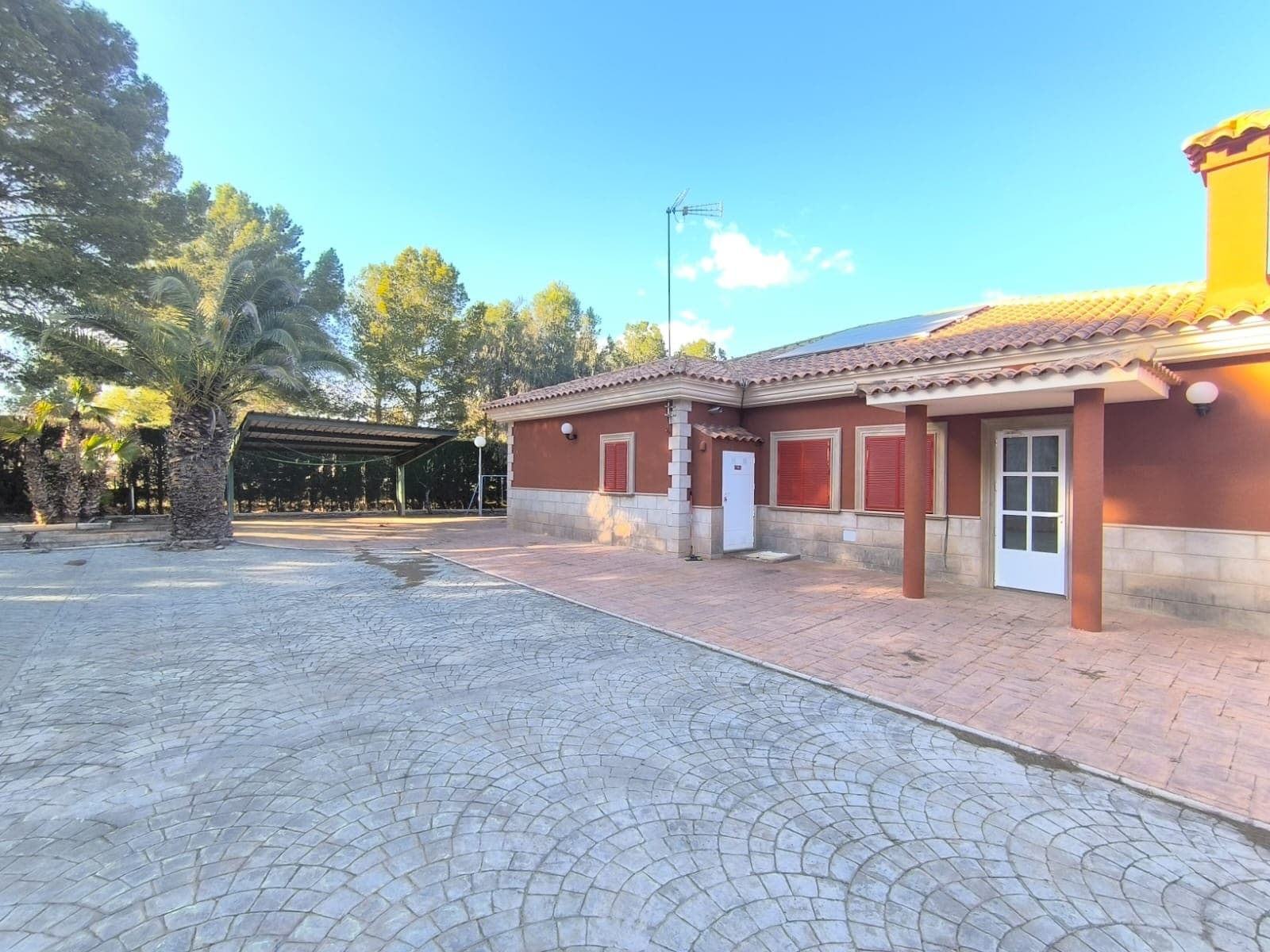 Discover this beautiful villa located in a serene neighbourhood, just 4 km from Yecla town, where you can enjoy easy access to shops, schools, and bars. This exceptional property comprises two modern houses constructed with high-quality materials, offering both comfort and style.Main Villa (built in 2002) features:5 Bedrooms2 BathroomsA cosy salon complete with a chimneyA contemporary kitchenA large solariumAmple storage roomsFully furnished and stylishly designed interiorsThermal insulation for energy efficiency & gas central heating and air-conditioning for year-round comfortSecond House (Built in 2015) includes:A generous garage equipped with three electric doors, serving as a gymA guest annex featuring a wheelchair-accessible bathroomOutdoor Features - The exterior of the property is beautifully shaded by mature trees and includes:A covered pool measuring 10 x 4 meters, complete with a filtration system, ideal for relaxation or entertainingA well-maintained garden spanning 5600 m², perfect for leisure or plant cultivationA covered carportA spacious patioAdditional Conveniences include:A wastewater cleaning system that supports tree irrigationMains irrigation water and a drinking water tankBoth grid electricity and a 2 kW solar panel systemAn alarm system connected to the police station for added securityThis beautiful, modern, and stylish house is ready to move in. Don't miss this opportunity to enjoy a luxurious lifestyle for a friendly price!About the area: Yecla is renowned for its wine production, historical landmarks, and vibrant local culture. The surrounding natural landscapes provide opportunities for outdoor activities, while the town itself offers all necessary services, including schools, shops, and restaurants. This property combines the tranquility of countryside living with easy access to modern amenities.About us: We have a large portfolio of properties in the Costa Blanca and Costa Calida areas, specialising in country properties, villas, fincas, building plots and design and build options in the Alicante and Murcia regions with a particular emphasis on Elda, Monovar, Pinoso, Sax, Villena, Aspe, Fortuna, Albacete and many more surrounding areas. We have been established since 2004 and have decades of experience between the team which we bring to bear to help you find and secure your new dream home. We help you every step of the way to make sure your purchase in Spain is safe and hassle free. We are not here to sell you a property, we are here to help you realise your dream and find what is right for you. With us you are in the safest hands. Contact us now to have a no obligation chat about how you too can realise your dreams.