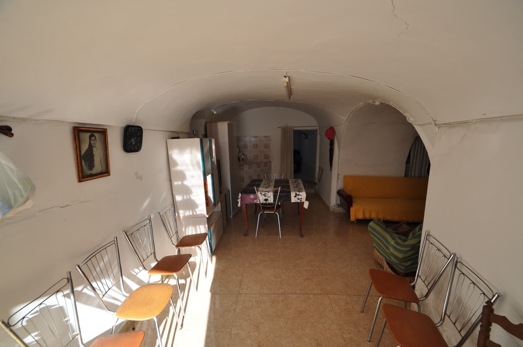 Located just 10 minutes from Fortuna, this spacious 4-bedroom cave house offers a unique blend of comfort and natural living in the heart of the mountains. Perfect for those who value peace and beautiful surroundings, the main living area features a large fireplace, ideal for cozy evenings. The property also includes plenty of storage and a garage that's ready for conversion into a second bathroom, adding both convenience and future potential.The fenced plot is complemented by two versatile outbuildings, perfect for additional storage, a workshop, or creative projects. Enjoy the tranquility of mountain living with the town of Fortuna just a short drive away.If you liked this property, do not hesitate to contact us to organize a visit, we will be happy to help you!
