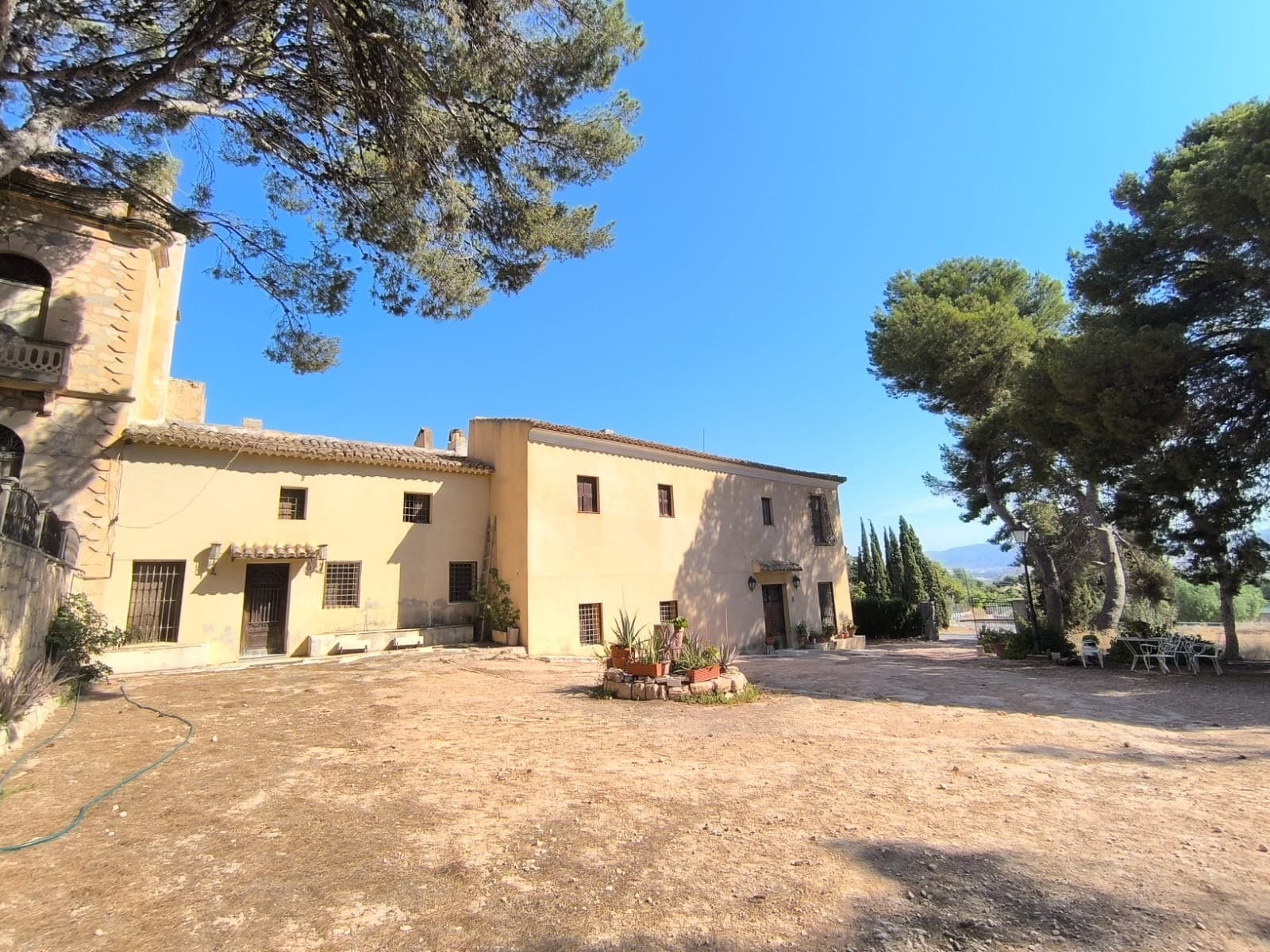 Historic 15-Bedroom Country Estate with 200 Hectares – Monóvar, AlicanteThis remarkable estate in Monóvar offers a rare opportunity to own a historic country property with vast development potential. With approximately 1,000 m² of built area and 2,000,000 m² (200 hectares) of private land, this property includes pine forests, 25 hectares of almond groves, and mountainous terrain ideal for hiking or hunting. The land also provides superb views across the valley towards Elda and Monóvar.The main house, dating back to the 1800s, retains original features and historic character. It comprises 15 bedrooms and 4 bathrooms across a spacious layout that invites renovation. Several outbuildings accompany the main house, including one currently used as a family home and another with a large dining hall for gatherings or events. Additional warehouses and garages on the estate offer potential for conversion into guest houses, leisure facilities, or further accommodation.This is an ideal investment for those looking to develop a rural hotel, retreat center, or agri-tourism project in an authentic Mediterranean setting.About the Area: Located just minutes from the towns of Monóvar and Elda, the estate is well-connected yet offers complete privacy and tranquility. Monóvar is known for its wine production, natural landscapes, and traditional charm. Alicante and its international airport are just 35–40 minutes away, making this estate accessible for tourism or commercial use.We are specialists in the Costa Blanca and Costa Calida specialising in the Alicante and Murcia Inland regions with a particular emphasis on Elda, Pinoso, Aspe, Elche and surrounding areas. We are an established, well known and trusted company that has built a solid reputation amongst buyers and sellers since we began trading in 2004. We offer a complete service with no hidden charges or surprises, starting with sourcing the property, right through to completion, and an unrivalled after sales service which includes property management, building services, and general help and advice to make your new house a home. With a portfolio of well over 1400 properties for sale, we are confident that we can help, so just let us know your preferred property, budget and location, and we will do the rest.
