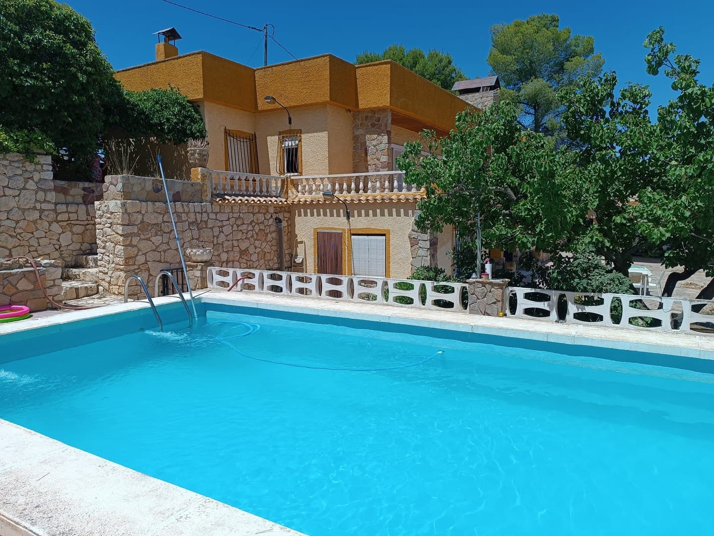 Presenting you a large, ready to move in detached villa in Yecla. Exceptional location - only 1.5 km west from the town centre, within walking distance from local shops, workshops, bars and other amenities. The large house boasts total of 7 bedrooms, 3 bathrooms, large salon, a dining room and an independent kitchen. Outside, find a covered car port, a large roofed terrace, BBQ area, and a luxurious pool. The property of 338 m2 built, based on a fenced plot of 2000 m2, is connected to grid electricity and drinking water, and has a central heating system. Don't miss out this splendid opportunity and arrange a viewing today!About the area: Yecla is renowned for its wine production, historical landmarks, and vibrant local culture. The surrounding natural landscapes provide opportunities for outdoor activities, while the town itself offers all necessary services, including schools, shops, and restaurants. This property combines the tranquility of countryside living with easy access to modern amenities.About us: We have a large portfolio of properties in the Costa Blanca and Costa Calida areas, specialising in country properties, villas, fincas, building plots and design and build options in the Alicante and Murcia regions with a particular emphasis on Elda, Monovar, Pinoso, Sax, Villena, Aspe, Fortuna, Albacete and many more surrounding areas. We have been established since 2004 and have decades of experience between the team which we bring to bear to help you find and secure your new dream home. We help you every step of the way to make sure your purchase in Spain is safe and hassle free. We are not here to sell you a property, we are here to help you realise your dream and find what is right for you. With us you are in the safest hands. Contact us now to have a no obligation chat about how you too can realise your dreams.