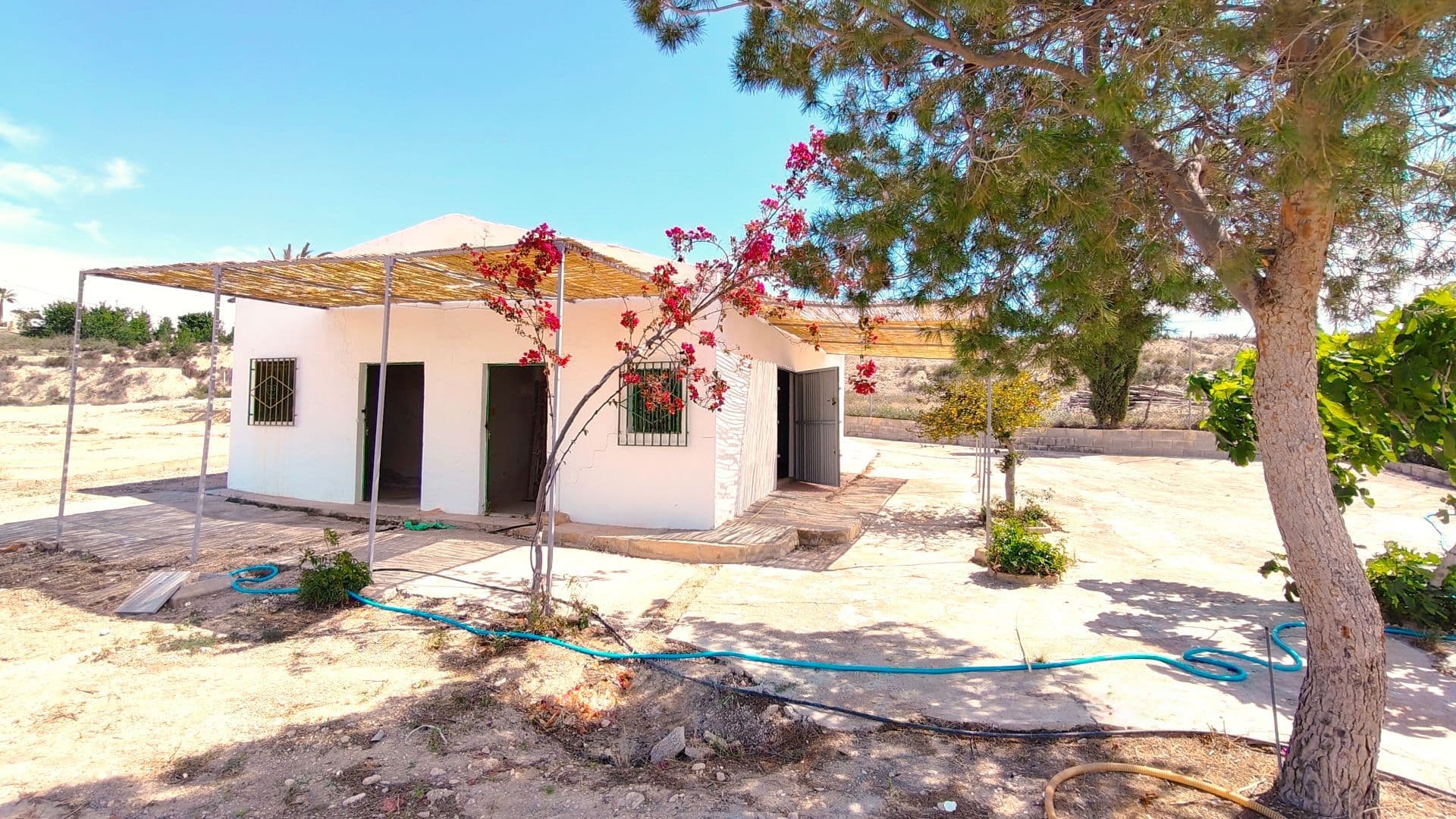 Property with House and Segregation Potential in Mahoya, Abanilla (Murcia)Located in the hamlet of Mahoya, Abanilla (Murcia), this 19,044 m² property combines the peace of a rural setting with excellent development potential.The estate includes a house in need of renovation, currently distributed across two bedrooms, one bathroom, a spacious living room with a fireplace, and two additional rooms that could be adapted to expand the living area or create new spaces as needed.The property is fully equipped with essential utilities: drinking water, irrigation water, electricity, and a septic tank. It borders two asphalted roads, providing easy access from different directions.Another key advantage is its proximity to the village centre — less than one kilometre away — where you'll find all local services and amenities.One of the most attractive aspects of this estate is its segregation potential. The plot can be divided into up to three independent units: A main plot of 14,000 m², where the existing house is located. Two urbanisable plots of 2,522 m² each, with access to all utilities. This flexibility makes it ideal both for those seeking a large family estate and for investors looking for a development opportunity in a well-connected rural area.With its location, size, and range of possibilities, this property represents an excellent investment in a peaceful countryside environment with open views and easy access.We have a large portfolio of properties in the Costa Blanca and Costa Calida areas, specialising in country properties, villas, fincas, building plots and design and build options in the Alicante and Murcia regions with a particular emphasis on Elda, Monovar, Pinoso, Sax, Villena, Aspe, Fortuna, Albacete and many more surrounding areas. We have been established since 2004 and have decades of experience between the team which we bring to bear to help you find and secure your new dream home. We help you every step of the way to make sure your purchase in Spain is safe and hassle free. We are not here to sell you a property, we are here to help you realise your dream and find what is right for you. With us you are in the safest hands. Contact us now to have a no obligation chat about how you too can realise your dreams.