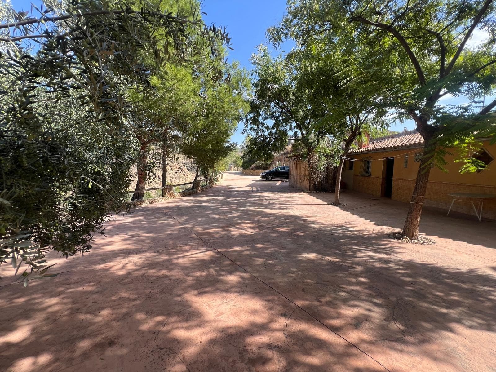 This rural complex in Abanilla (Murcia), located next to the Chícamo River, offers a unique opportunity to acquire a fully operating and licensed hospitality business. Set on approximately 15,698 m² of land, the property features a charming two-storey wooden house that is fully equipped and connected to a cave house with an open kitchen and fireplace. The complex is currently used as a retreat destination and is also rented for events, providing multiple income streams.On the lower level of the property, there are two additional caves: one is fitted and ready to be rented, while the second is used as an event hall with its own kitchen and bathroom. Next to the wooden house and the main cave house, there is another construction offering more rooms, additional kitchens, bathrooms, and flexible accommodation spaces. The entire setting enjoys beautiful views and a peaceful environment that attracts guests seeking nature, privacy, and a unique stay experience.The sale also includes three additional plots: one of 2,795 m², another of 6,708 m², and an urban plot of 1,118 m², offering further potential for expansion or future development. The business is already generating steady income, and the number of beds is currently being increased to accommodate more guests, enhancing profitability even further. This is a strong, established investment with room to grow.About the Area Abanilla is known for its natural landscapes, traditional charm, and tranquil setting. The Chícamo River area is especially appreciated for its scenic beauty, walking routes, and peaceful atmosphere. Despite its rural surroundings, the property remains well connected to nearby towns and essential services, making it an attractive destination for visitors. The region draws nature lovers, retreat groups, and travelers looking for authentic experiences in a quiet environment.If you liked this property, do not hesitate to contact us to organize a visit, we will be happy to help you!We have a large portfolio of properties in the Costa Blanca and Costa Calida areas, specialising in country properties, villas, fincas, building plots and design and build options in the Alicante and Murcia regions with a particular emphasis on Elda, Monovar, Pinoso, Sax, Villena, Aspe, Fortuna, Albacete and many more surrounding areas. We have been established since 2004 and have decades of experience between the team which we bring to bear to help you find and secure your new dream home. We help you every step of the way to make sure your purchase in Spain is safe and hassle free. We are not here to sell you a property, we are here to help you realise your dream and find what is right for you. With us you are in the safest hands. Contact us now to have a no obligation chat about how you too can realise your dreams.