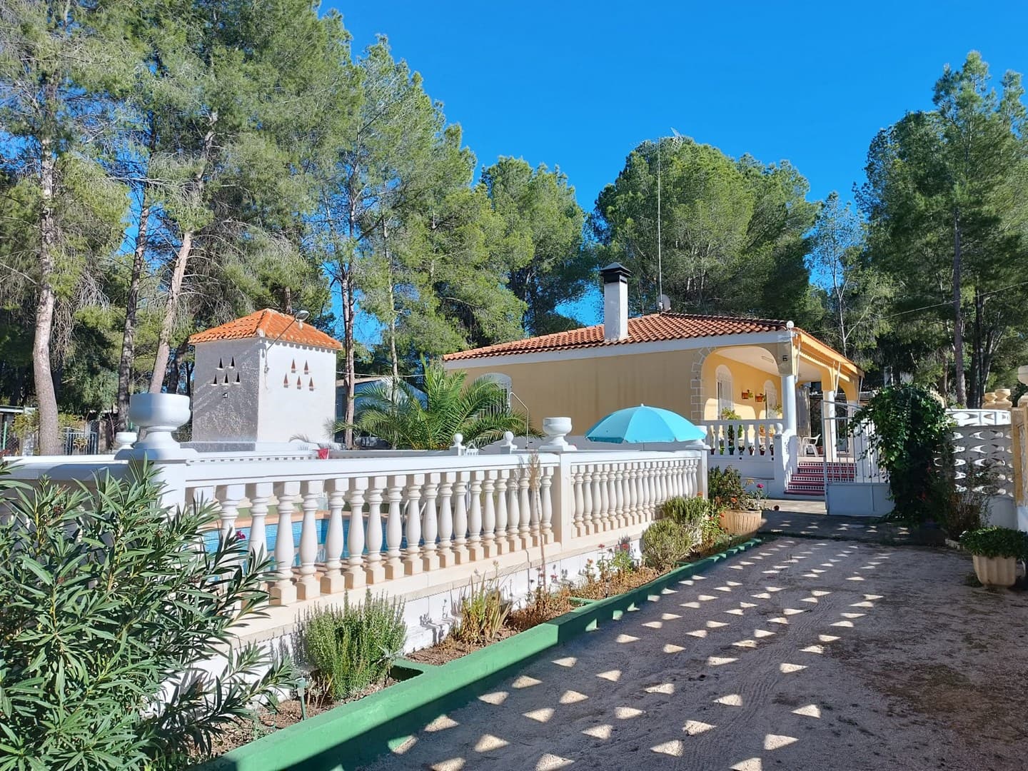 Discover this wonderful detached villa set on a beautifully fenced plot of 1,270 m², offering comfort, space, and tranquility just 3 km from Yecla's town centre.The property has a built area of 207 m², distributed as follows: 111 m² of living space with 4 bedrooms and 2 bathrooms A 26 m² porch with summer awnings - perfect for relaxing outdoors 19 m² of storage space A 23 m² swimming pool (40,000 litres) with filtration system A 28 m² barbecue area with a fireplace and traditional wood-burning ovenInside, the home features a spacious 40 m² living-dining room with a fireplace, two kitchens, and a pellet stove for cosy winter evenings. Quality finishes include stoneware floors, pine interior doors, and aluminium folding exterior carpentry.The exterior is equally impressive, with a covered car park for up to 4 cars, an additional storage room, and a lush, well-maintained garden filled with mature trees - mainly pines - providing excellent natural shade.This property is fully connected to mains water and electricity, and easily accessible via paved roads in a quiet, sought-after area.A unique opportunity to enjoy peace, privacy, and nature — all within minutes of the town centre.About the area: Yecla is a charming and historic town of app. 35000 inhabitants, located in the region of Murcia. It is renowned for its award-winning wines, historical landmarks, and vibrant local culture. The surrounding natural landscapes of scenic mountains, vineyards and almond groves provide opportunities for outdoor activities, while the town itself offers all necessary services, including hospital, schools, shops, restaurants, and other services. With a friendly local community, lively markets, excellent gastronomy, and easy access to nature, Yecla is an ideal location for those seeking authentic Spanish lifestyle - just about an hour from the coast and Alicante airport.About us: We have a large portfolio of properties in the Costa Blanca and Costa Calida areas, specialising in country properties, villas, fincas, building plots and design and build options in the Alicante and Murcia regions with a particular emphasis on Elda, Monovar, Pinoso, Sax, Villena, Aspe, Fortuna, Albacete and many more surrounding areas. We have been established since 2004 and have decades of experience between the team which we bring to bear to help you find and secure your new dream home. We help you every step of the way to make sure your purchase in Spain is safe and hassle free. We are not here to sell you a property, we are here to help you realise your dream and find what is right for you. With us you are in the safest hands. Contact us now to have a no obligation chat about how you too can realise your dreams.