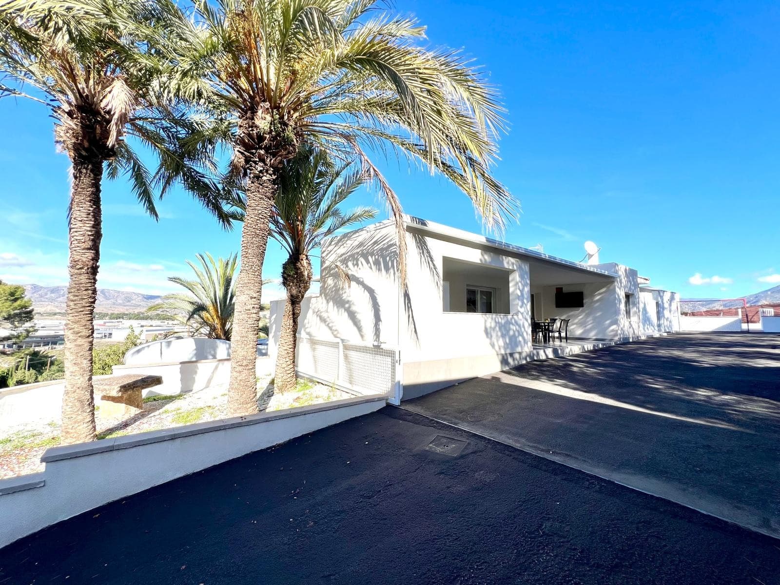 This modern villa offers a comfortable and practical layout, ideal for those seeking space, privacy, and a move-in ready home. Fully renovated, it features new plumbing, new electrical installation, air conditioning and heating, and a complete alarm system. Located just 5 minutes from the town of Elda, the property sits in a quiet area with open views and convenient access to a large town and all its services.The main house is sold unfurnished and includes a fully equipped kitchen, three bedrooms on the main floor, and two bathrooms. Motorized sliding entrance gate and motorized shutters add convenience and security. On the lower level (basement), you will find an additional bedroom, a bathroom, a multipurpose area perfect for a games room or gym, and a storage room.The exterior is designed for outdoor living. The pool offers spectacular views, with a porch area beside it which is ideal for relaxing on sun loungers. There is also a 30 m² garage, a dedicated outdoor bathroom, all on a fully fenced plot with covered parking.A separate guest house completes the property, equipped with an open-plan living-kitchen area and its own bathroom — an ideal space for gatherings, meals, and hosting visitors.About the Area The villa is located in a peaceful setting just outside Elda, a town known for its services, shops, healthcare facilities, schools, and excellent road connections. The area offers a good balance between rural tranquility and easy access to daily essentials, with nature, hiking routes, and local gastronomy close at hand.Important InformationOnly a part of the house is registered on the title deeds - an area of approximate area of 126 square metres. Several other areas, including the under build, swimming pool, pool porch, car port and guest annexe have existed since pre 2009, which means that with a certificate of antiquity we could have them added to the Deeds and Land Registry. However, there are parts such as the garage and a storage room which don't have the necessary antiquity of 15 years to enable us to have them added to the title deeds. As such, the seller does not want to draw attention to the property and wishes to sell it as seen. This means that any potential buyer is buying the property with the paperwork as it currently stands, and with the full knowledge that there are buildings on the plot that are currently not reflected on the title deeds or Land Registry.In theory, once the prescribed period has passed for all buildings, the property can be fully registered. Until such time has elapsed it is best to leave the paperwork as is. With this in mind, the seller has reduced the price by €30,000 in order for any potential buyer to accept the risk to the garage and storage room. If the buyer is a cash buyer then the above does not necessarily present any issues. However, if you do need a mortgage then based on the 126 square metres in the title deeds, it may not necessarily give you the valuation that you need in order to obtain a mortgage or tha bank may present conditions on the mortgage offer. The reason being the bank will only value what is registered on the title deeds.If you are still interested and would like to arrange to view please do not hesitate to contact us or indeed if you have further questions and would like further clarification. We are here to help.The property does represent excellent value for money at its current price, given the condition of the property and its location. And the price now also reflects the issues that are beung assumed by any Buyer.We have a large portfolio of properties in the Costa Blanca and Costa Calida areas, specialising in country properties, villas, fincas, building plots and design and build options in the Alicante and Murcia regions with a particular emphasis on Elda, Monovar, Pinoso, Sax, Villena, Aspe, Fortuna, Albacete and many more surrounding areas. We have been established since 2004 and have decades of experience between the team which we bring to bear to help you find and secure your new dream home. We help you every step of the way to make sure your purchase in Spain is safe and hassle free. We are not here to sell you a property, we are here to help you realise your dream and find what is right for you. With us you are in the safest hands. Contact us now to have a no obligation chat about how you too can realise your dreams