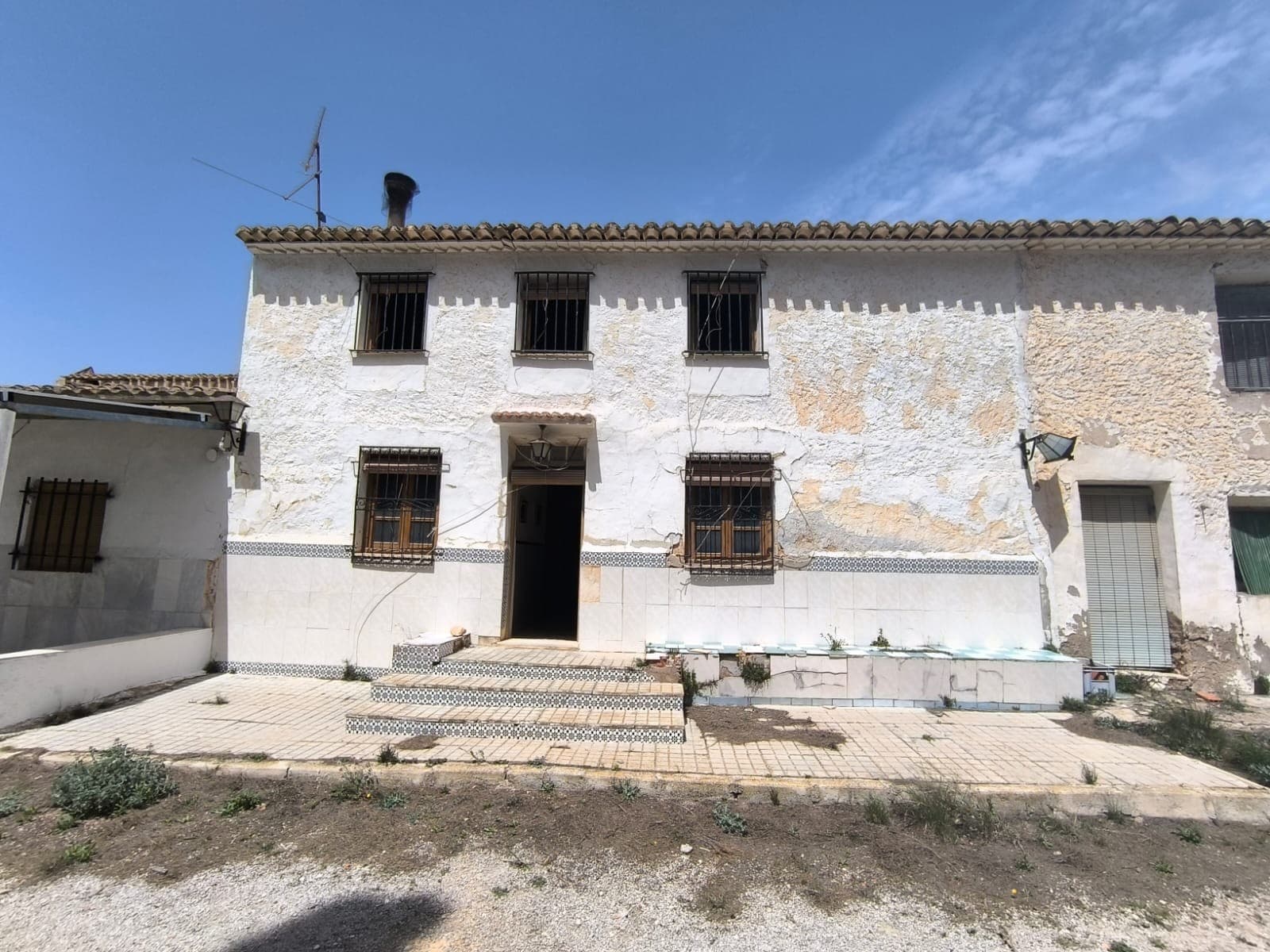 We present you this attached country house for bargain price! The property features an easy-to-access, spacious country house of 150 m² across two floors, located just 7 km from Yecla. The house boasts 6 bedrooms, a bathroom, and a cosy lounge/dining room with an integrated kitchen, complete with a fireplace for added warmth and ambiance. The property needs some restoration work, is attached to neighbouring houses from both sides and is located very close to a main road, which creates some noise. With the house comes a generous land of 130,000 m², spread across multiple parcels and terrains nearby, the land is not compact (see pictures, the land included is marked with yellow).The neighbouring house - 41045b-PB - which shares one wall, courtyard and water deposit with this property, is for sale as well. For combined price of 199.000 €, you could buy both properties at once to gain almost 400,000 m² of land: 41045-PBWater supply is ensured through a private well and water deposit. The property is not connected to mains electricity. While in need of a solar system and new wiring, it offers an opportunity for off-grid living. Nestled in a picturesque natural setting, the house provides panoramic views. Thanks to its location and expansive land, this property is particularly suited for equestrian enthusiasts and is ideal for placing olive, almond, pistachio, or vineyard plantations. Don't miss the chance to own this versatile and serene country retreat.About the area: Yecla is renowned for its wine production, historical landmarks, and vibrant local culture. The surrounding natural landscapes provide opportunities for outdoor activities, while the town itself offers all necessary services, including schools, shops, and restaurants. This property combines the tranquility of countryside living with easy access to modern amenities.About us: We have a large portfolio of properties in the Costa Blanca and Costa Calida areas, specialising in country properties, villas, fincas, building plots and design and build options in the Alicante and Murcia regions with a particular emphasis on Elda, Monovar, Pinoso, Sax, Villena, Aspe, Fortuna, Albacete and many more surrounding areas. We have been established since 2004 and have decades of experience between the team which we bring to bear to help you find and secure your new dream home. We help you every step of the way to make sure your purchase in Spain is safe and hassle free. We are not here to sell you a property, we are here to help you realise your dream and find what is right for you. With us you are in the safest hands. Contact us now to have a no obligation chat about how you too can realise your dreams.