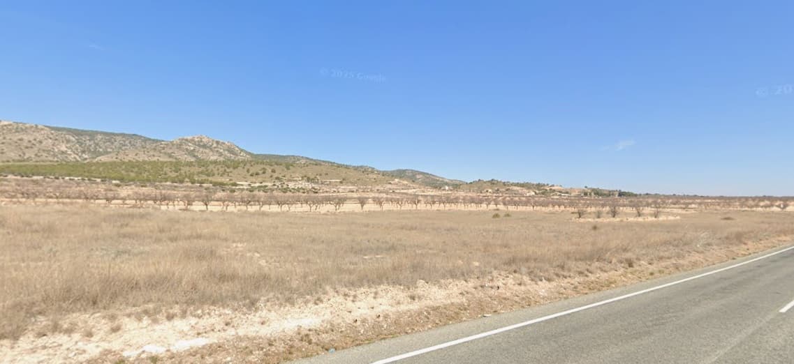 Legal building plot of over 13800 m2 for sale in a picturesque valley. Located in Jumilla municipality, near Pinoso. The land, clean and fallow, offers stunning mountain views, and a convenient asphalted access of the main road. It is flat and easy to build on. You are allowed to build up to 250 m2 on a single level (or 200 m2 over 2 levels), including the living unit, swimming pool, a garage etc. We can help you with the building design and connect you with architects, builders, solar panels company etc. The house will need to operate off-grid, which is not an issue today. If you liked this property, do not hesitate to contact us to organize a visit, we will be happy to help you!Distances:La Alberquilla (the closest village with a bar) - 0.8 kmPinoso (the closest town with markets, schools, clinics, vet, gyms, etc.) - 7 km, 5 minElche (the closest city) - 45 minAlicante airport - 50 minBeach - 52 minAbout the area: Pinoso (Alicante, Spain), known for its stunning countryside, and welcoming atmosphere, offers a perfect blend of traditional Spanish culture and modern conveniences. Surrounded by picturesque vineyards and rolling hills, Pinoso is renowned for its quality of life, with excellent local amenities, schools, and easy access to both the vibrant cities of Alicante and Elche, as well as beautiful Mediterranean beaches. Whether you're seeking a peaceful rural retreat or a family-friendly community, Pinoso is an ideal place to invest in property, combining serene living with great potential for growth.About us: We have a large portfolio of properties in the Costa Blanca and Costa Calida areas, specialising in country properties, villas, fincas, building plots and design and build options in the Alicante and Murcia regions with a particular emphasis on Elda, Monovar, Pinoso, Sax, Villena, Aspe, Fortuna, Albacete and many more surrounding areas. We have been established since 2004 and have decades of experience between the team which we bring to bear to help you find and secure your new dream home. We help you every step of the way to make sure your purchase in Spain is safe and hassle free. We are not here to sell you a property, we are here to help you realise your dream and find what is right for you. With us you are in the safest hands. Contact us now to have a no obligation chat about how you too can realise your dreams.
