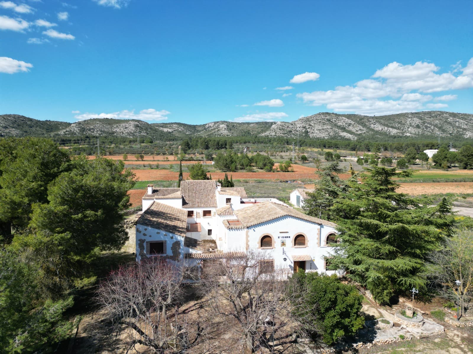 Large Rural Tourism Complex with Restaurant and Accommodation Near Banyeres de MariolaConsists of a nine-bedroom hotel, five individual apartments, and bar and restaurant facilities. All with licences in place. This unique commercial property offers an exceptional opportunity for hospitality or tourism projects. Set on a 25,000 m² plot with a total built area of 1,700 m², the property combines accommodation, dining facilities, and recreational areas in a beautiful countryside location close to Banyeres de Mariola and Bocairent.The complex includes 22 bedrooms and 17 bathrooms in total, arranged across several buildings and living areas. At the front of the property is the main house, a two-storey building with spacious living areas and additional accommodation. Behind the main house is a fully equipped restaurant with an industrial kitchen and a bodega-style wine tasting room, creating an ideal setting for events, dining experiences, or group stays.Above the restaurant area there is a hotel section with nine ensuite guest rooms, ready to accommodate visitors. On another side of the property there is a separate apartment, providing additional private living space for owners or guests.The grounds also include an outbuilding with a large open room that can be used as an event hall, games room, or activity space, as well as a large barbecue area designed for outdoor gatherings. Recreational facilities include a basketball court and extensive outdoor space that could be adapted for tourism activities, retreats, or celebrations.The property holds a tourist license, offering immediate potential for hospitality, rural tourism, retreats, or event-based businesses.About the AreaThe property is located in the countryside between Banyeres de Mariola and Bocairent, two historic towns known for their natural beauty, traditional architecture, and cultural heritage. The area is surrounded by the Sierra de Mariola Natural Park, offering excellent opportunities for hiking, cycling, and outdoor activities. Both towns provide restaurants, shops, and local services, while Alicante and Valencia are within comfortable driving distance. This region is popular with visitors seeking authentic inland Spain, making it an ideal location for a tourism or hospitality project.We have a large portfolio of properties in the Costa Blanca and Costa Calida areas, specialising in country properties, villas, fincas, building plots and design and build options in the Alicante and Murcia regions with a particular emphasis on Elda, Monovar, Pinoso, Sax, Villena, Aspe, Fortuna, Albacete and many more surrounding areas. We have been established since 2004 and have decades of experience between the team which we bring to bear to help you find and secure your new dream home. We help you every step of the way to make sure your purchase in Spain is safe and hassle free. We are not here to sell you a property, we are here to help you realise your dream and find what is right for you. With us you are in the safest hands. Contact us now to have a no obligation chat about how you too can realise your dreams.