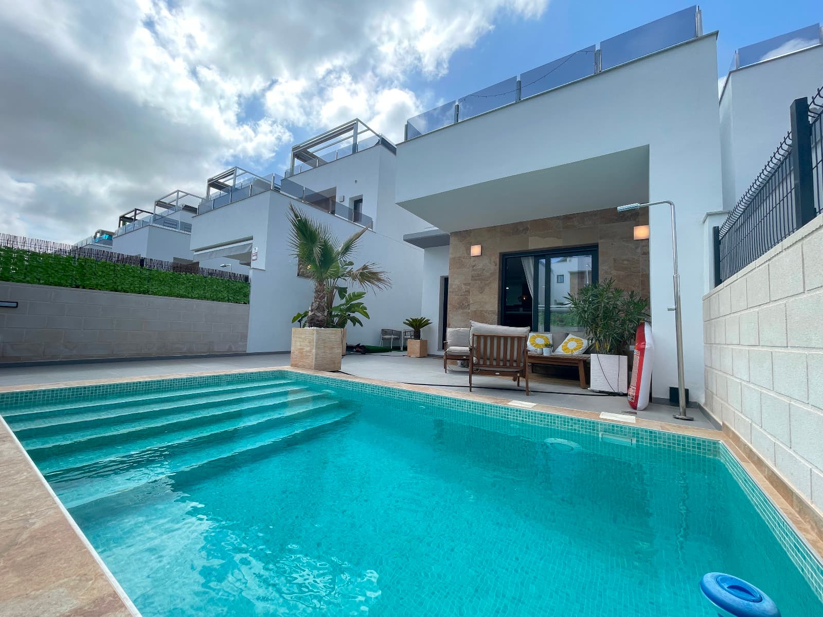 This stunning villa is in perfect condition and offers a contemporary design that prioritizes comfort and style. The open-concept living and dining area, along with a modern kitchen, creates a welcoming space that's ideal for both everyday living and entertaining guests.On the ground floor, you'll find a spacious bedroom with built-in wardrobes, accompanied by a full bathroom for added convenience. Upstairs, a charming landing leads out to a small terrace, an ideal spot to enjoy your morning coffee or relax in peace.The second bedroom is generously sized and comes with its own elegant en-suite bathroom. At the end of the hallway, the master bedroom provides a luxurious retreat, complete with an en-suite bathroom and direct access to a private terrace. This sun-filled space is perfect for unwinding and soaking up the beautiful Mediterranean climate.The villa is equipped with air conditioning and is move-in ready, ensuring you can enjoy comfort and quality from day one.Nestled in the heart of the Costa Blanca, Benijófar is a charming and well-connected town in the province of Alicante. With its laid-back Mediterranean atmosphere, Benijófar strikes the perfect balance between traditional Spanish character and modern amenities. Just a short drive from the stunning beaches of Guardamar and Torrevieja, and with all essential services—such as supermarkets, restaurants, cafés, and pharmacies—within walking distance, it's an ideal destination for both year-round living and holiday getaways.