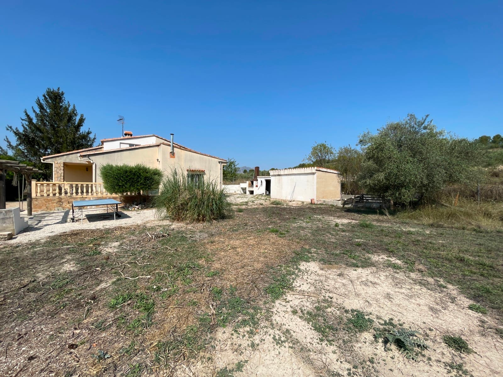 Exclusive opportunity in Millena: two homes, large plot, and private poolDiscover this beautiful country estate located in a unique natural setting, just 3 km from the charming village of Millena and only 8 minutes from Cocentaina. A peaceful retreat with everything you need to enjoy the Mediterranean lifestyle.The main house, 176 m² over two floors, welcomes you with a cozy front pergola. On the ground floor, you will find a spacious living-dining room with fireplace and air conditioning, a bright and practical kitchen, a full bathroom, and three double bedrooms. The upper floor has two more generous bedrooms, a guest toilet, and a second bathroom, providing plenty of space for family and friends.The +/- 8,000.00 m² plot, partially fenced, is planted with olive, fruit, and ornamental trees. It also includes a summer dining area, outdoor barbecue, storage room, and a private swimming pool surrounded by relaxation areas to enjoy the sun all year round.Additionally, there is an independent secondary house of 66 m², currently with kitchen, dining area, laundry room, two bathrooms, and two bedrooms. It only requires some finishing touches, making it perfect for guests, vacation rental, or as a second family home.Highlights: water, electricity, satellite TV, Climalit double-glazed windows, 4 air-conditioning units, and a fireplace for maximum comfort.Living in Millena means enjoying tranquility, nature, hiking and cycling trails, close to the Sierra de Mariola and with easy access to Cocentaina, Alcoy, and the coast.A unique property with two homes, large plot, pool, and an incomparable natural setting. Ideal as a family residence or investment property.